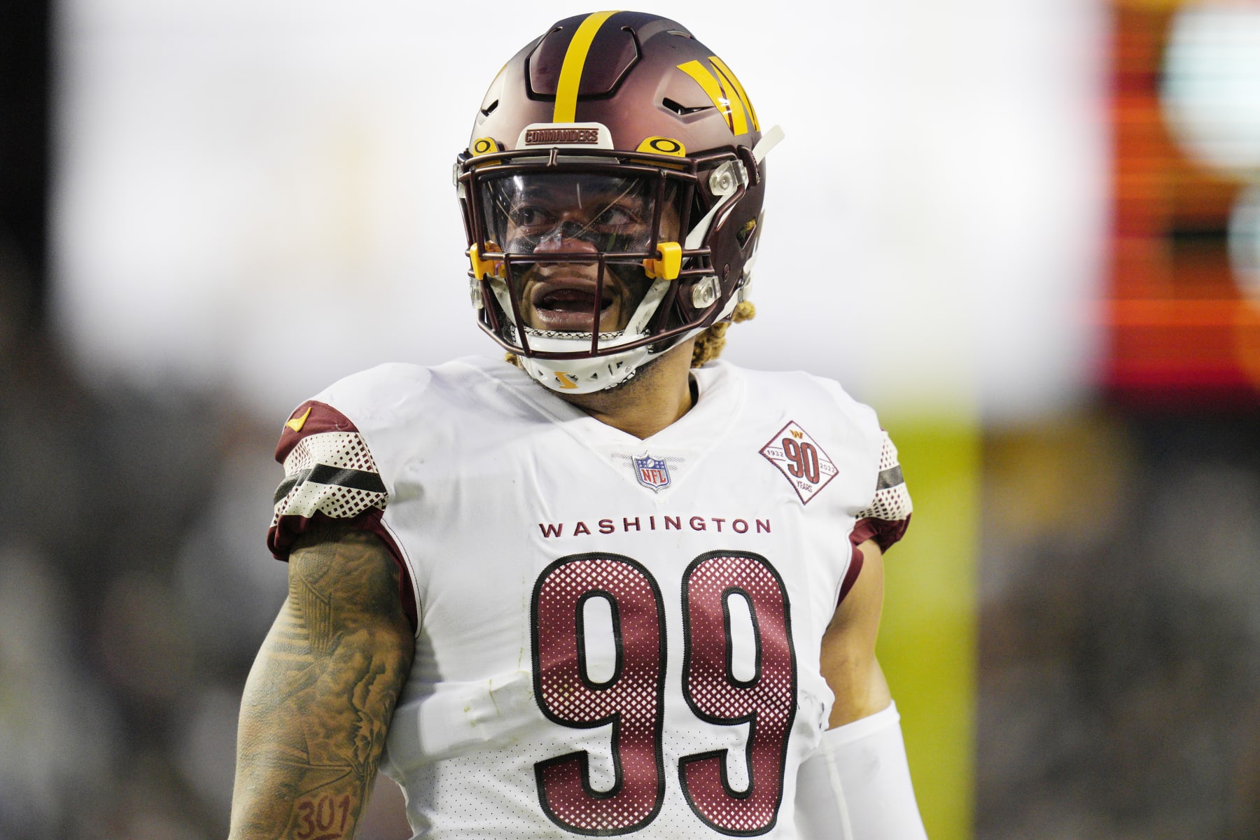 LANDOVER, MARYLAND - JANUARY 08: Chase Young #99 of the Washington Commanders looks on during the first half of the game against the Dallas Cowboys at FedExField on January 08, 2023 in Landover, Maryland. (Photo by Jess Rapfogel/Getty Images)