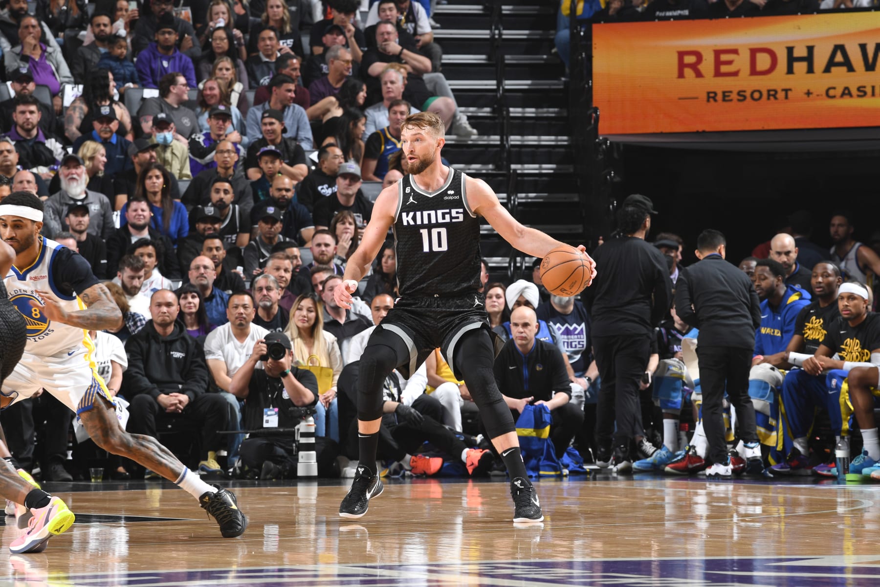 SACRAMENTO, CA - APRIL 17: Domantas Sabonis #10 of the Sacramento Kings moves the ball during Round 1 Game 2 of the 2023 NBA Playoffs on April 17 2023 at Golden 1 Center in Sacramento, California. NOTE TO USER: User expressly acknowledges and agrees that, by downloading and or using this Photograph, user is consenting to the terms and conditions of the Getty Images License Agreement. Mandatory Copyright Notice: Copyright 2023 NBAE (Photo by Noah Graham/NBAE via Getty Images)