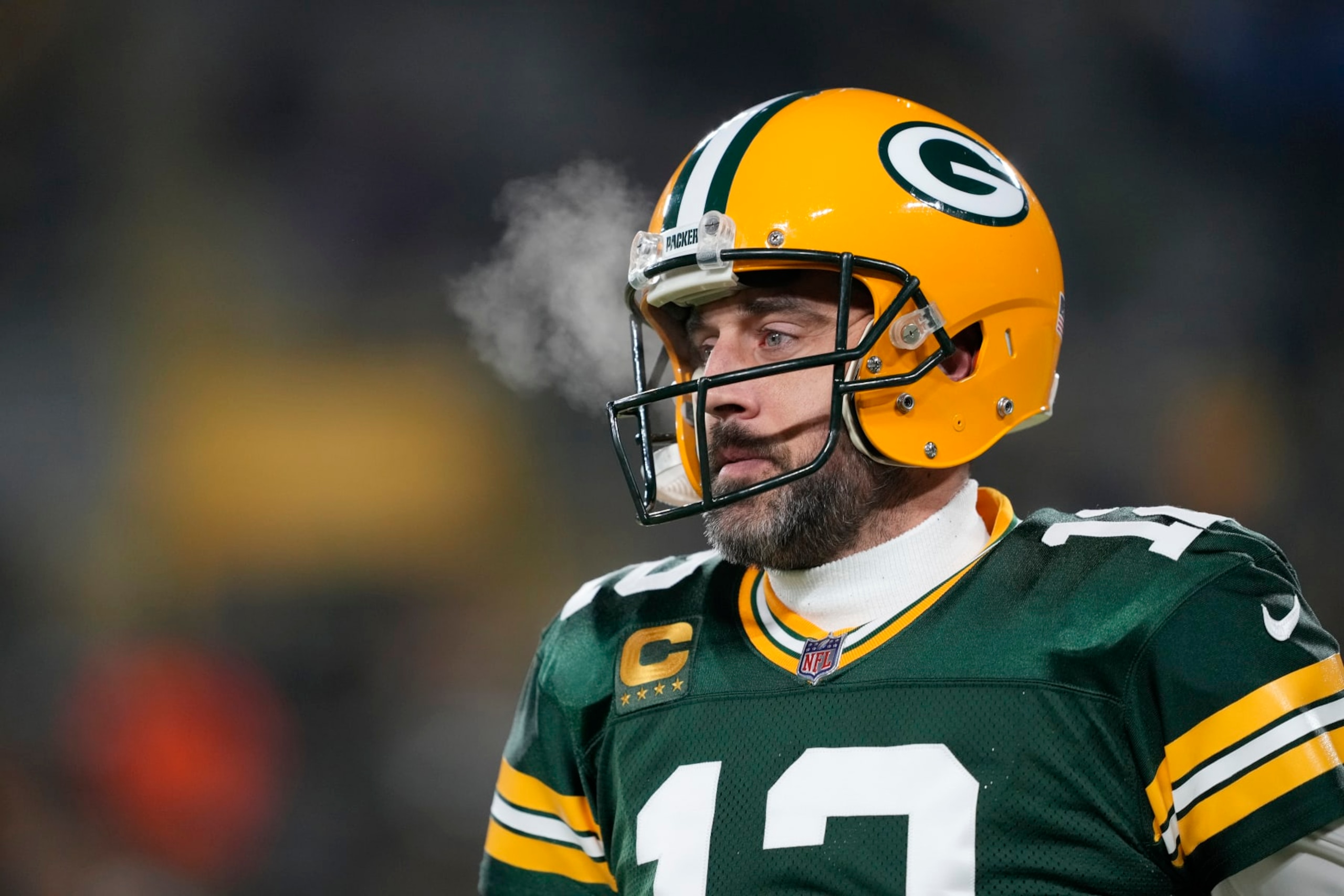 GREEN BAY, WISCONSIN - JANUARY 08: Aaron Rodgers #12 of the Green Bay Packers warms up before a game against the Detroit Lions at Lambeau Field on January 08, 2023 in Green Bay, Wisconsin. (Photo by Patrick McDermott/Getty Images)