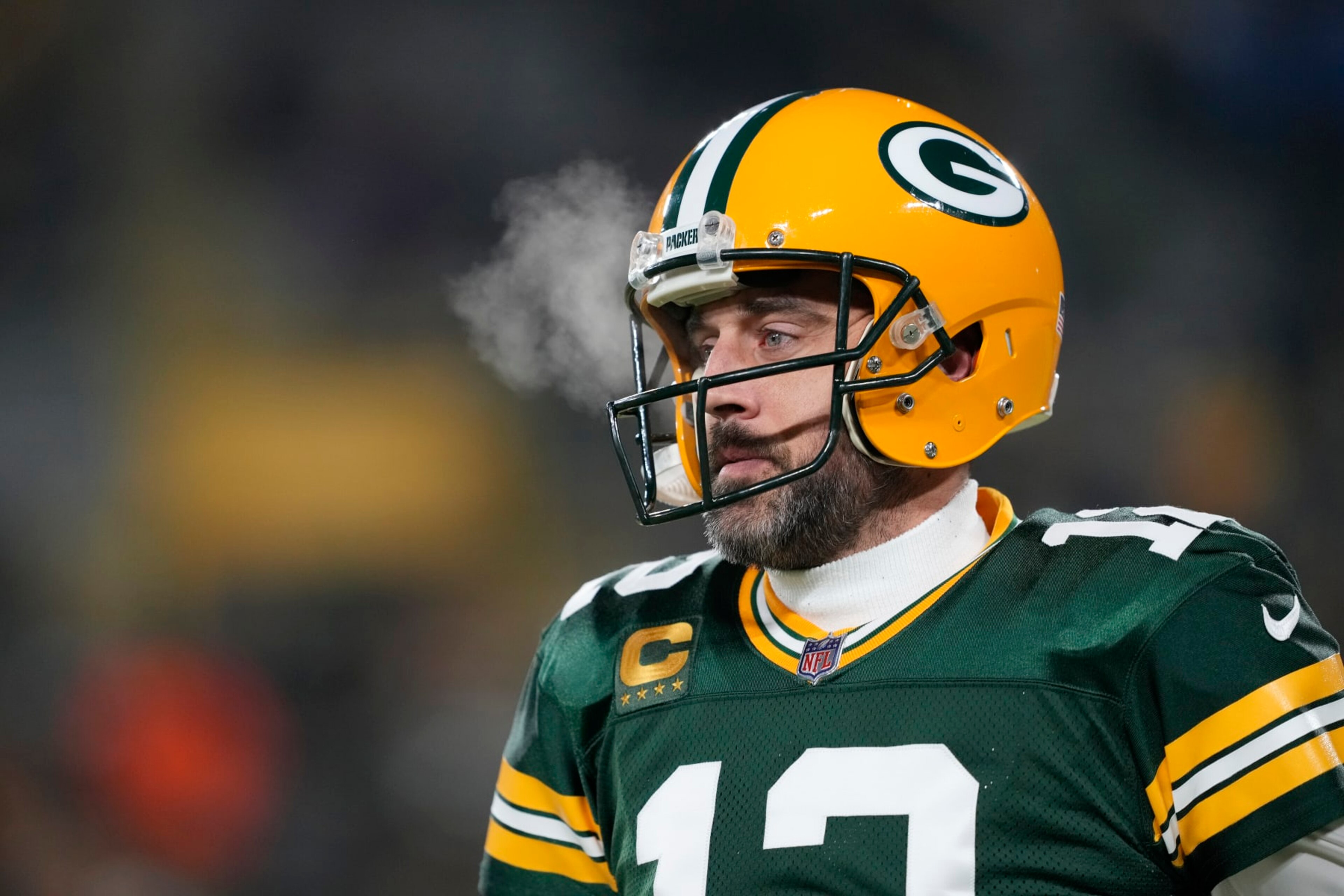 GREEN BAY, WISCONSIN - JANUARY 08: Aaron Rodgers #12 of the Green Bay Packers warms up before a game against the Detroit Lions at Lambeau Field on January 08, 2023 in Green Bay, Wisconsin. (Photo by Patrick McDermott/Getty Images)