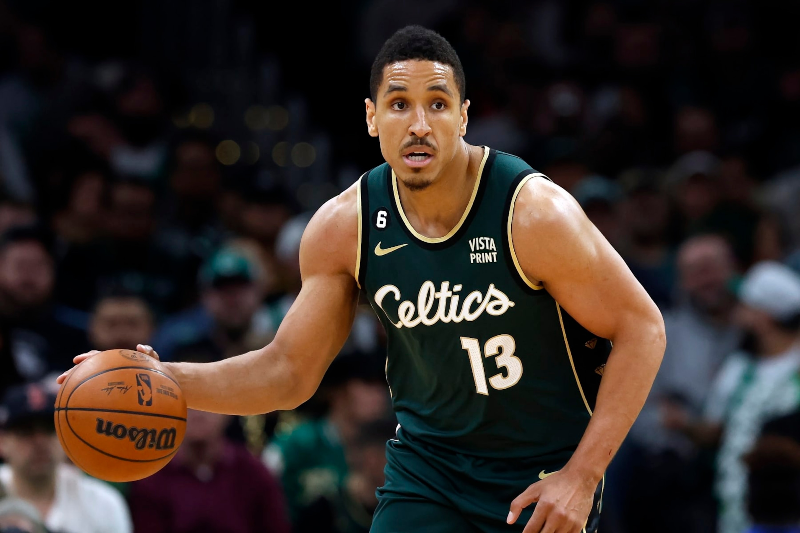 Boston Celtics' Malcolm Brogdon plays against the Atlanta Hawks in the first half during Game 1 in the first round of the NBA basketball playoffs, Saturday, April 15, 2023, in Boston. (AP Photo/Michael Dwyer)