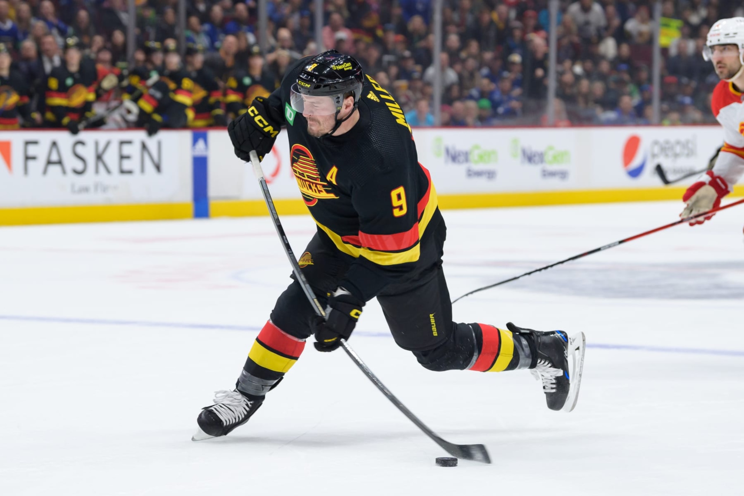 VANCOUVER, CANADA - APRIL 8: J.T. Miller #9 of the Vancouver Canucks takes a shot during the first period of their NHL game against the Calgary Flames at Rogers Arena on April 8, 2023 in Vancouver, British Columbia, Canada. (Photo by Derek Cain/Getty Images) VANCOUVER, CANADA - APRIL 8: J.T. Miller #9 of the Vancouver Canucks takes a shot during the first period of their NHL game against the Calgary Flames at Rogers Arena on April 8, 2023 in Vancouver, British Columbia, Canada. (Photo by Derek Cain/Getty Images)