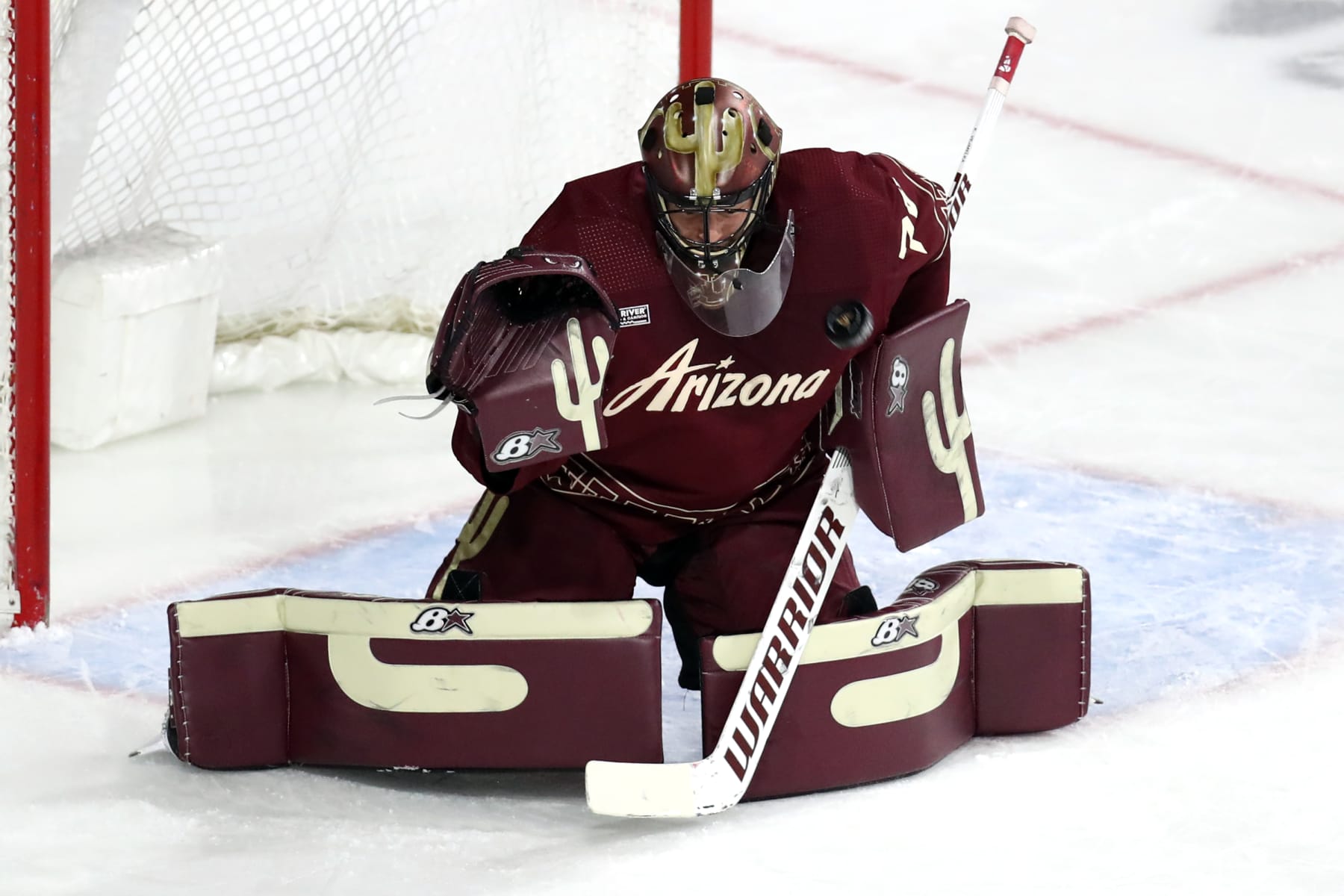 TEMPE, AZ - MARCH 31: Arizona Coyotes goaltender Karel Vejmelka (70) makes a save during the first period of a hockey game between the Arizona Coyotes and the Dallas Stars on March 31st, 2023, at Mullett Arena in Tempe, AZ. (Photo by Zac BonDurant/Icon Sportswire via Getty Images)