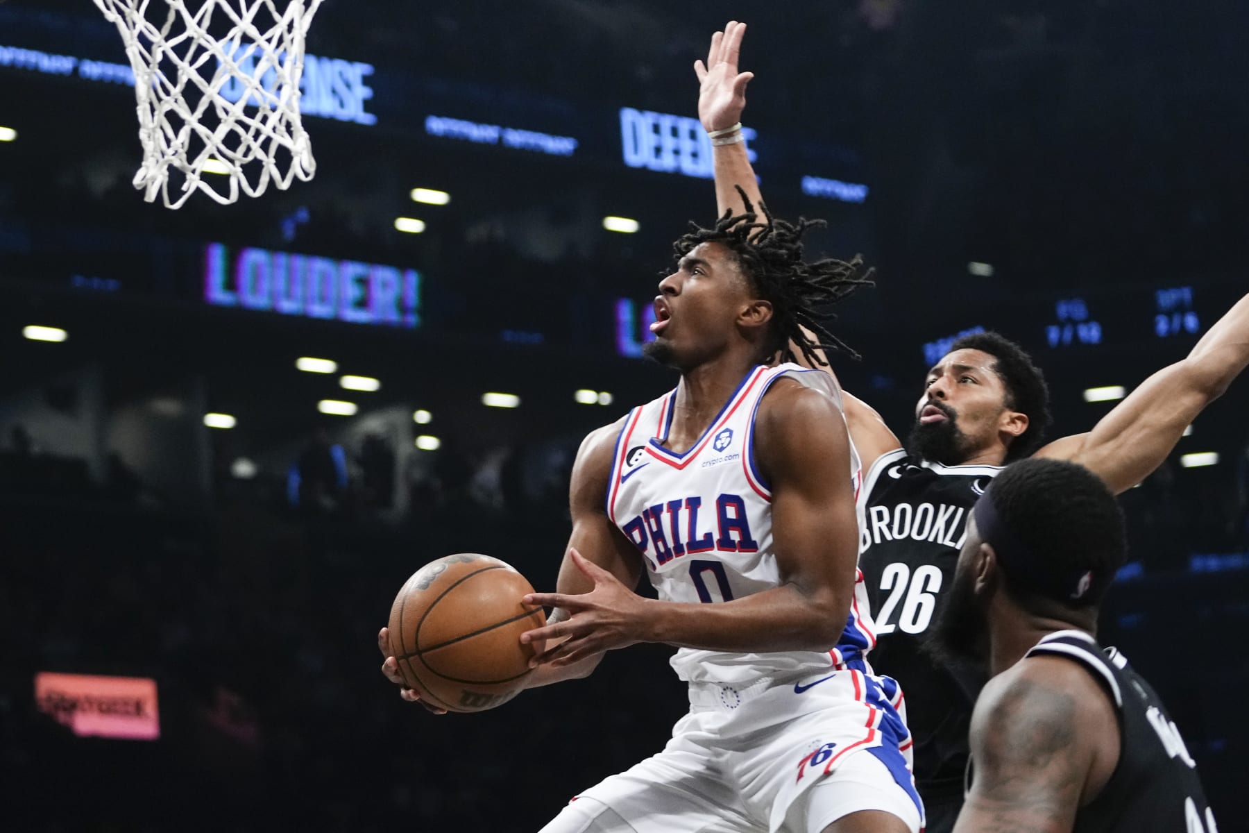Philadelphia 76ers' Tyrese Maxey (0) drives past Brooklyn Nets' Spencer Dinwiddie (26) during the first half of Game 3 in an NBA basketball first-round playoff series Thursday, April 20, 2023, in New York. (AP Photo/Frank Franklin II)