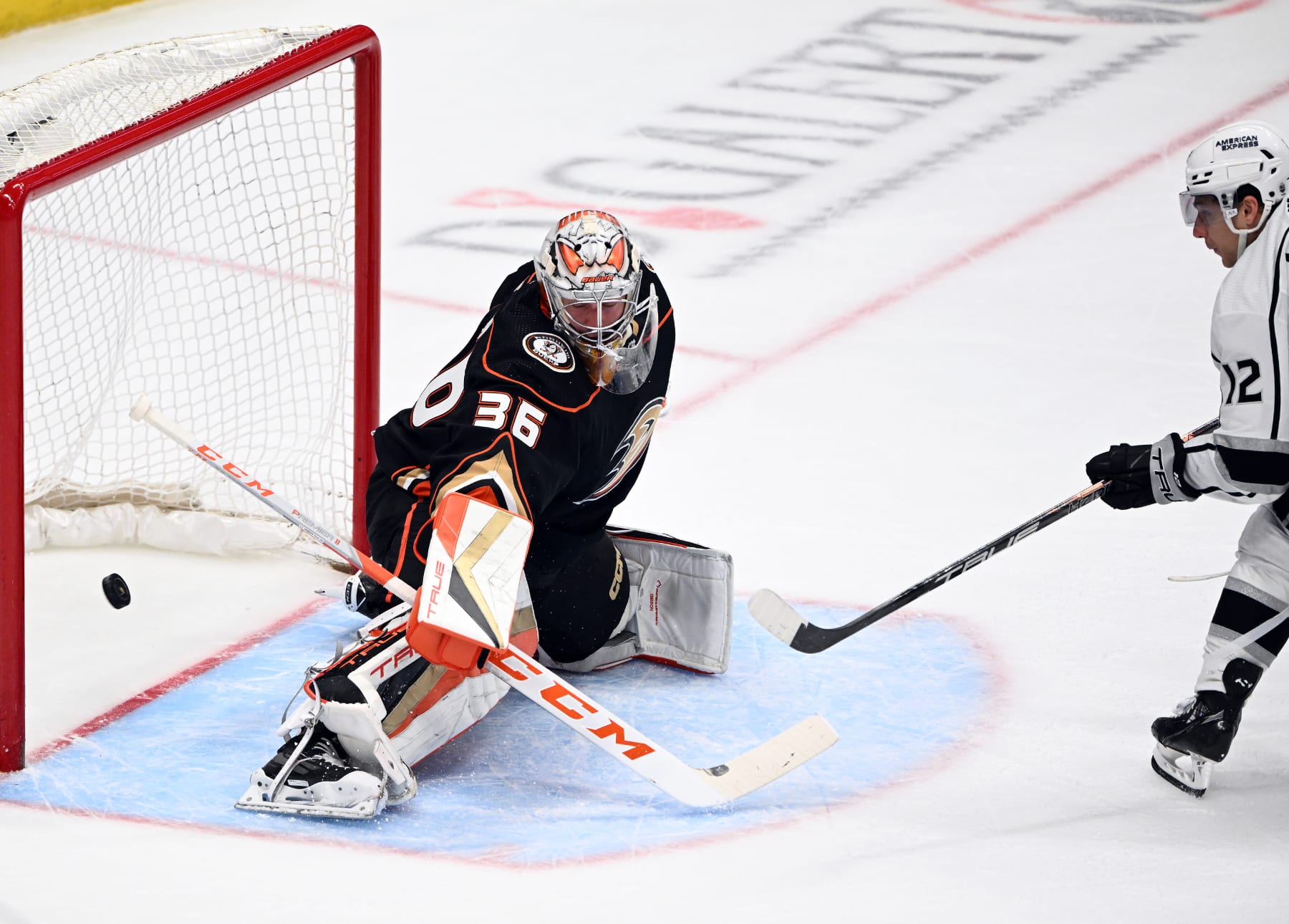 ANAHEIM, CA - APRIL 13: The puck goes past Anaheim Ducks goalie John Gibson (36) for a goal by Los Angeles Kings left wing Trevor Moore (12) during the second period of an NHL hockey game played on April 13, 2023 at the Honda Center in Anaheim, CA. (Photo by John Cordes/Icon Sportswire via Getty Images)