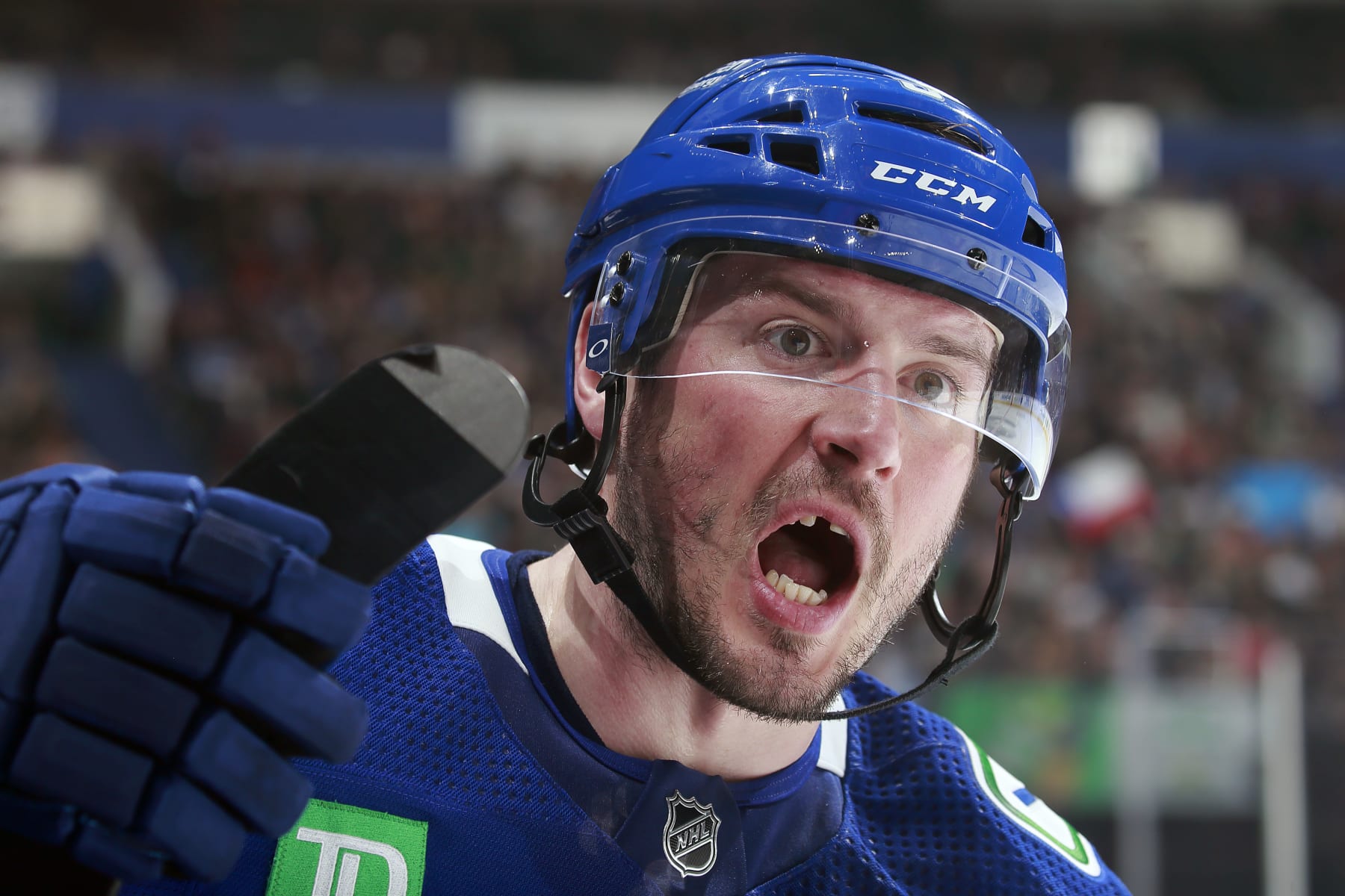 VANCOUVER, CANADA - APRIL 6: J.T. Miller #9 of the Vancouver Canucks looks on from the bench during their NHL game against the Chicago Blackhawks at Rogers Arena April 6, 2023 in Vancouver, British Columbia, Canada.  (Photo by Jeff Vinnick/NHLI via Getty Images)
