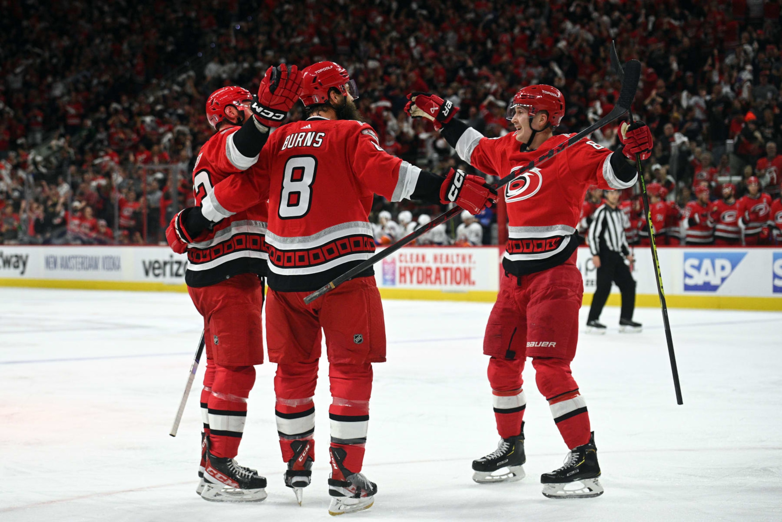 RALEIGH, NC - APRIL 19: Members of the Carolina Hurricanes celebrate scoring a goal during game 2 of the first round of the Stanley Cup Playoffs between the New York Islanders and the Carolina Hurricanes on April 19, 2023 at PNC Arena in Raleigh, North Carolina. (Photo by Katherine Gawlik/Icon Sportswire via Getty Images)