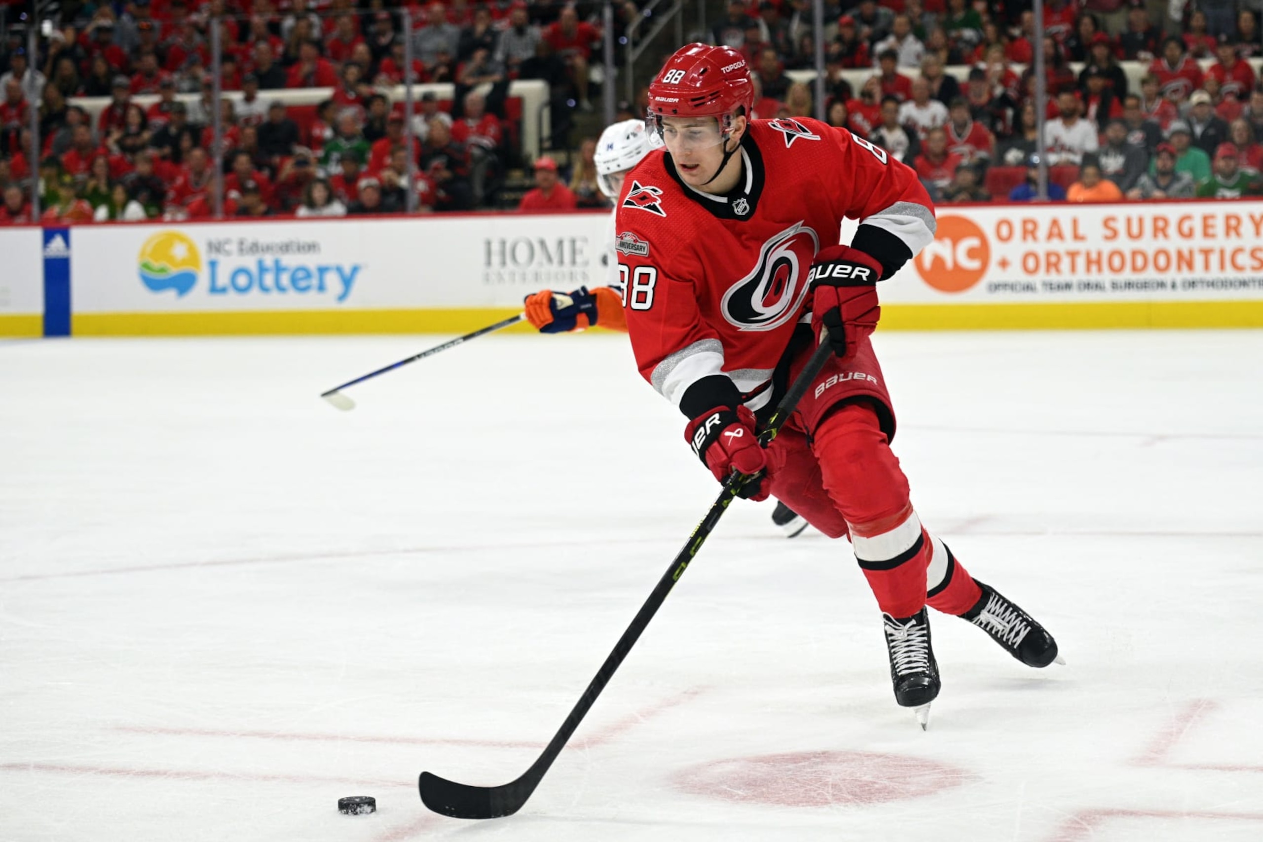 RALEIGH, NC - APRIL 19: Carolina Hurricanes Right Wing Martin Necas (88) maintains possession of the puck during game 2 of the first round of the Stanley Cup Playoffs between the New York Islanders and the Carolina Hurricanes on April 19, 2023 at PNC Arena in Raleigh, North Carolina. (Photo by Katherine Gawlik/Icon Sportswire via Getty Images)