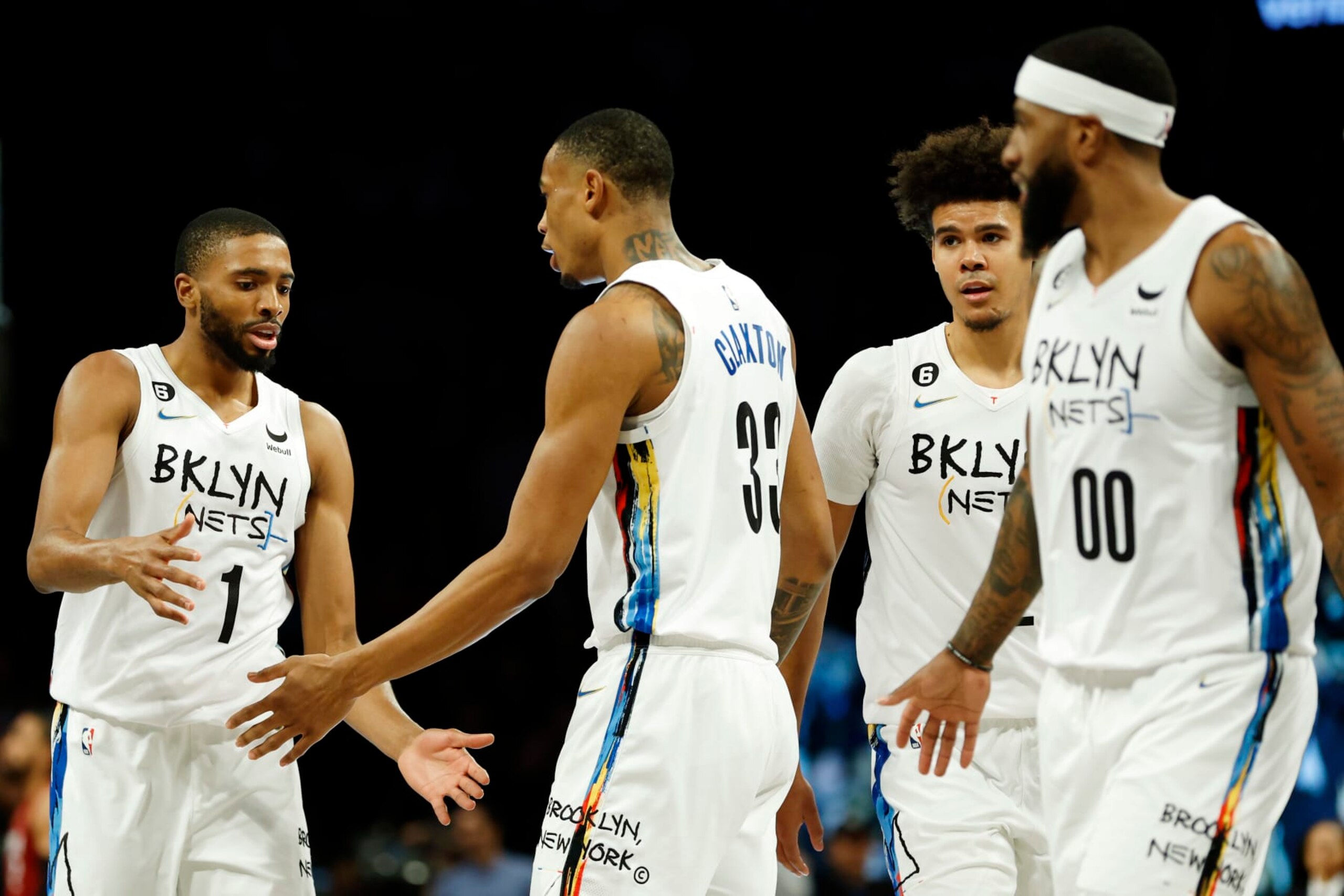 NEW YORK, NEW YORK - FEBRUARY 15: Mikal Bridges #1 celebrates with Nic Claxton #33 of the Brooklyn Nets during the second half against the Miami Heat at Barclays Center on February 15, 2023 in the Brooklyn borough of New York City. The Nets won 116-105. NOTE TO USER: User expressly acknowledges and agrees that, by downloading and/or using this photograph, User is consenting to the terms and conditions of the Getty Images License Agreement. (Photo by Sarah Stier/Getty Images)