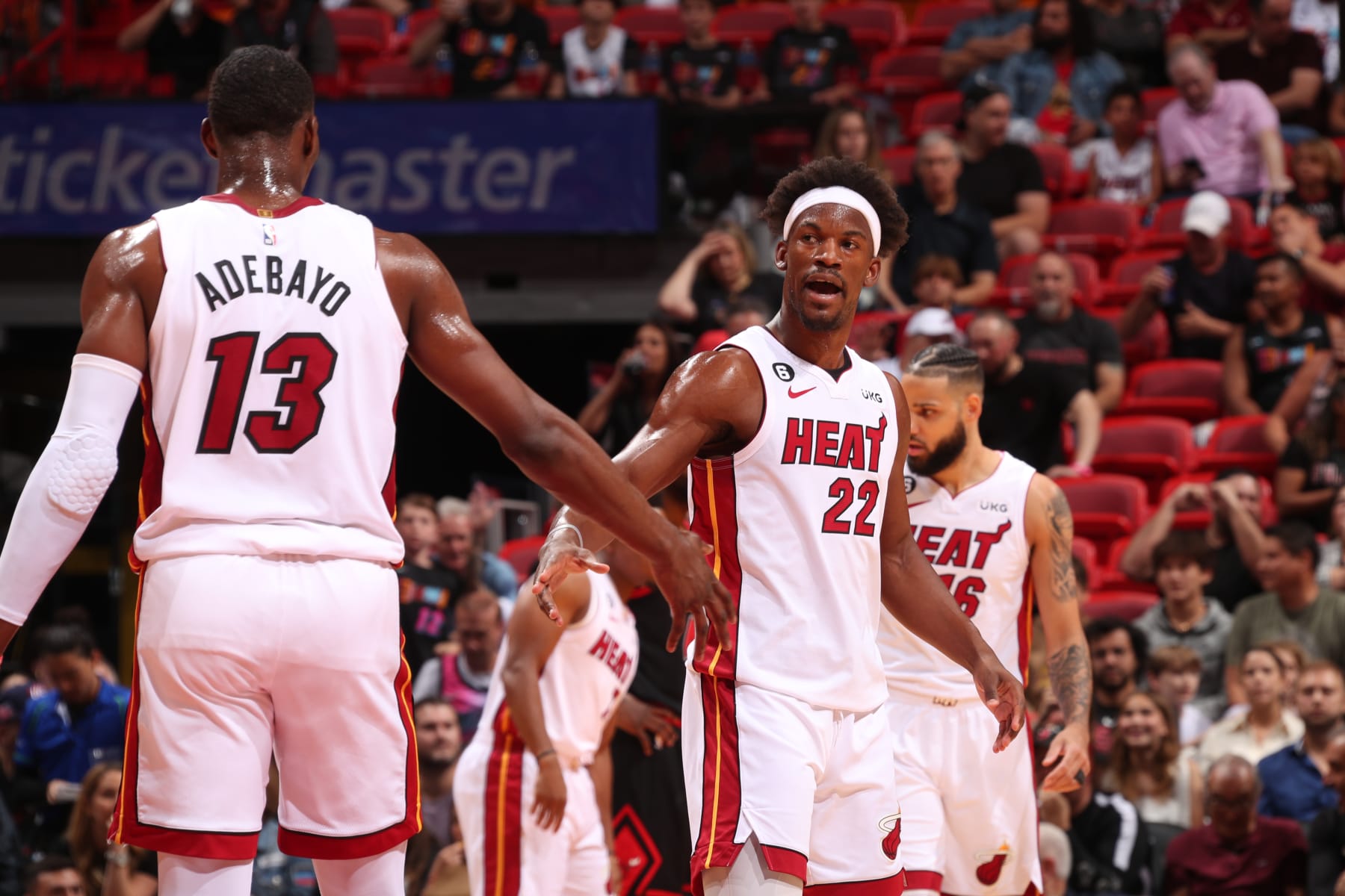 MIAMI, FL - APRIL 14: Bam Adebayo #13 and Jimmy Butler #22 of the Miami Heat high five during the game against the Chicago Bulls during the 2023 Play-In Tournament on April 14, 2023 at the Kaseya Center in Miami, Florida. NOTE TO USER: User expressly acknowledges and agrees that, by downloading and or using this Photograph, user is consenting to the terms and conditions of the Getty Images License Agreement. Mandatory Copyright Notice: Copyright 2023 NBAE (Photo by Issac Baldizon/NBAE via Getty Images)