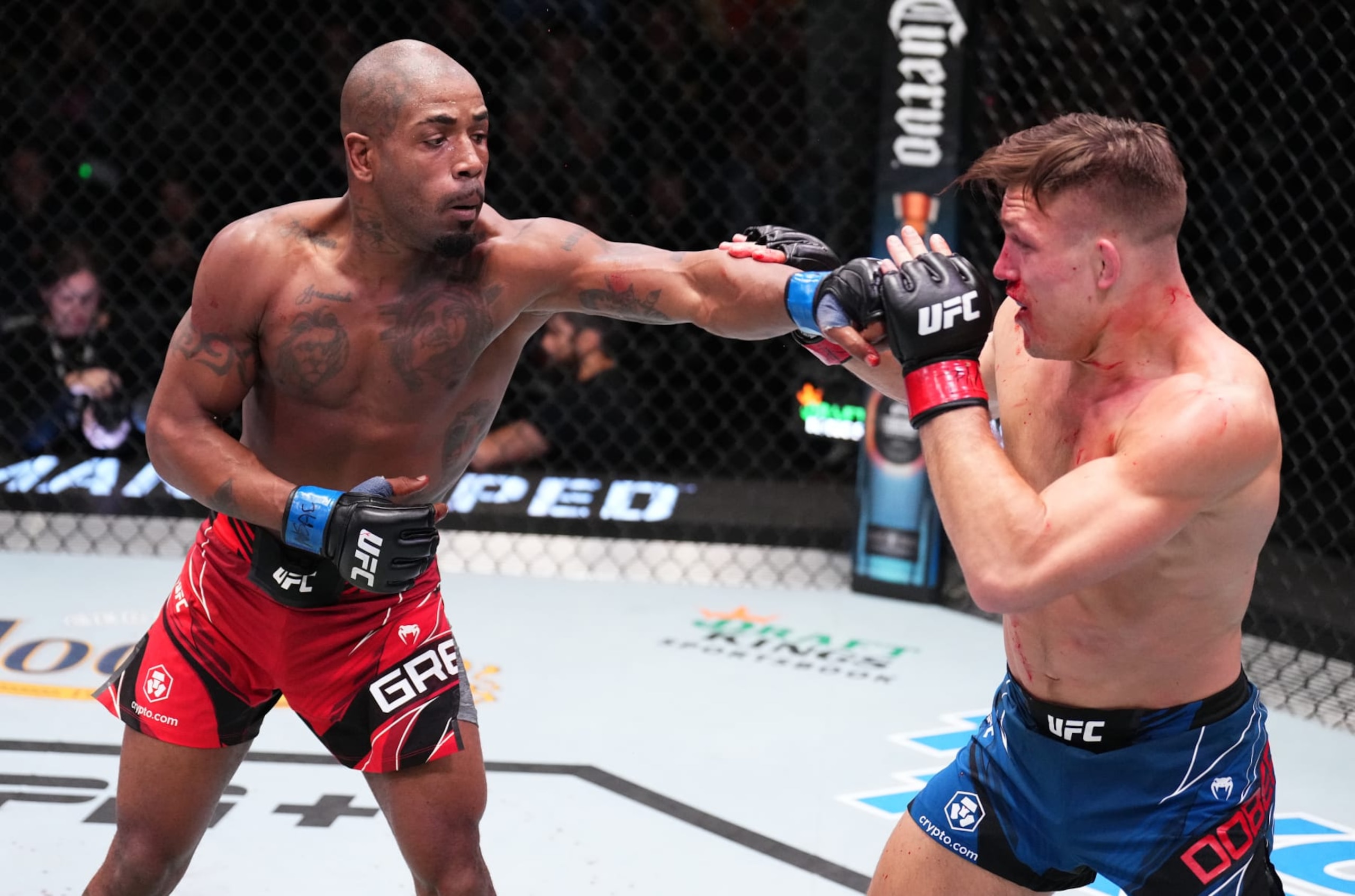 Bobby Green lands a punch against Drew Dober.