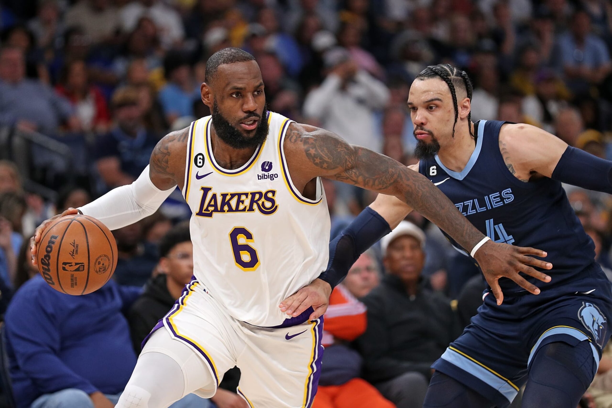 MEMPHIS, TENNESSEE - APRIL 16: LeBron James #6 of the Los Angeles Lakers handles the ball against Dillon Brooks #24 of the Memphis Grizzlies during the first half of Game One of the Western Conference First Round Playoffs at FedExForum on April 16, 2023 in Memphis, Tennessee. NOTE TO USER: User expressly acknowledges and agrees that, by downloading and or using this photograph, User is consenting to the terms and conditions of the Getty Images License Agreement.  (Photo by Justin Ford/Getty Images)