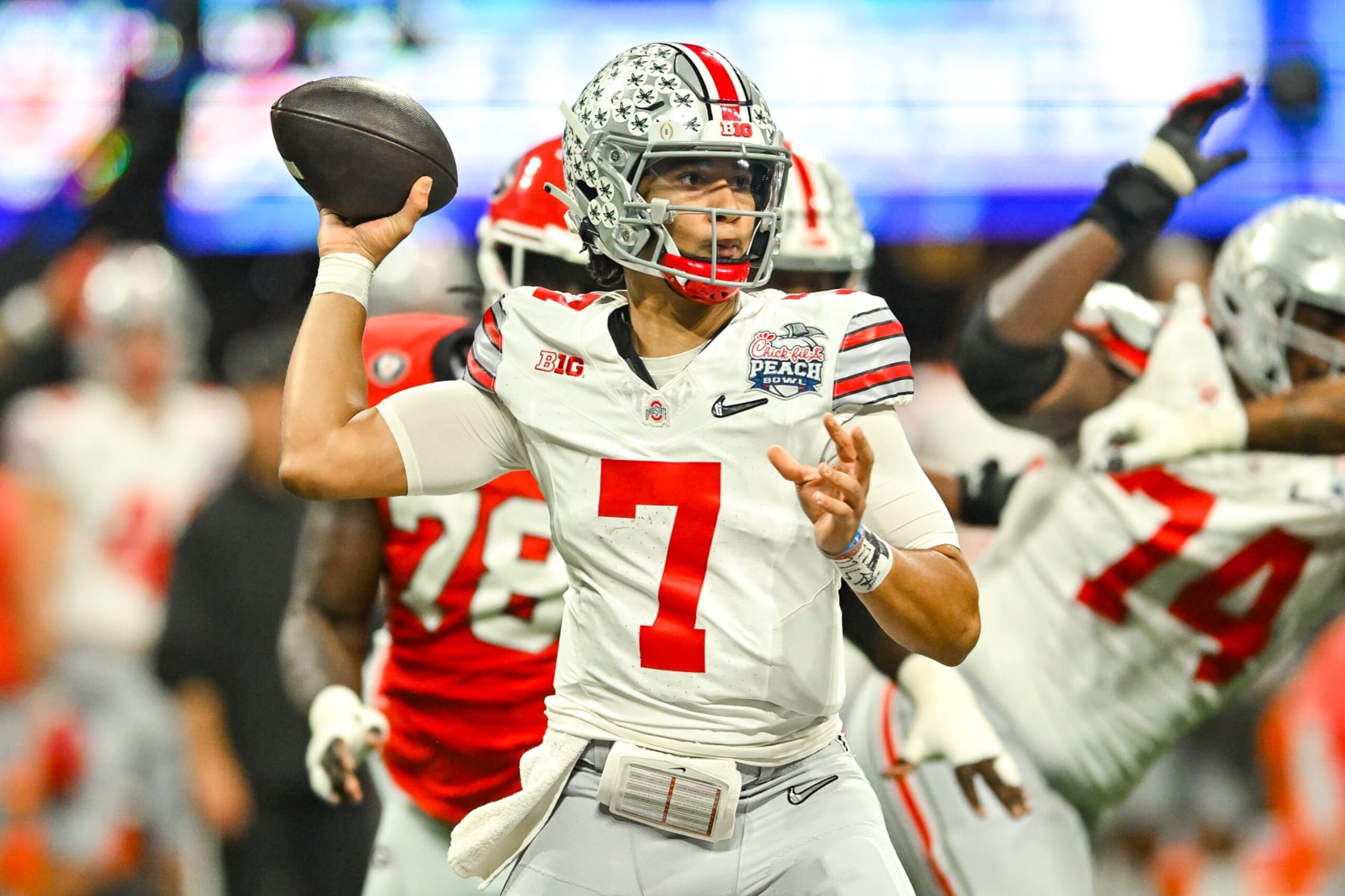 ATLANTA, GA  DECEMBER 31:  Ohio State quarterback C.J. Stroud (7) drops back to pass during the Chick-fil-A Peach Bowl college football playoff game between the Ohio State Buckeyes and the Georgia Bulldogs on December 31st, 2022 at Mercedes-Benz Stadium in Atlanta, GA.  (Photo by Rich von Biberstein/Icon Sportswire via Getty Images)