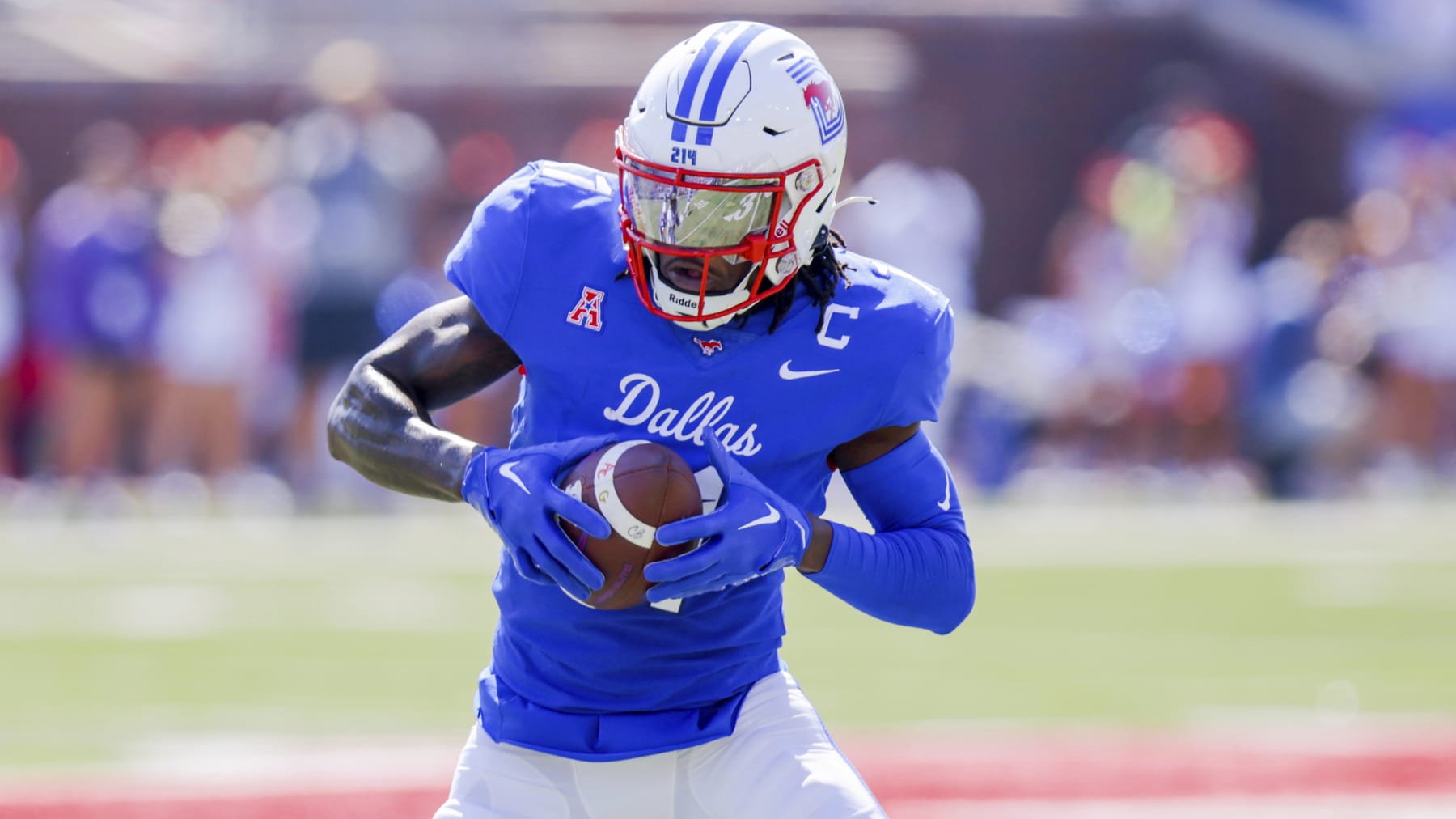 SMU wide receiver Rashee Rice looks to run after catching a pass during the first half of an NCAA college game against TCU on Saturday, Sept. 24, 2022, in Dallas, Texas. (AP Photo/Gareth Patterson)