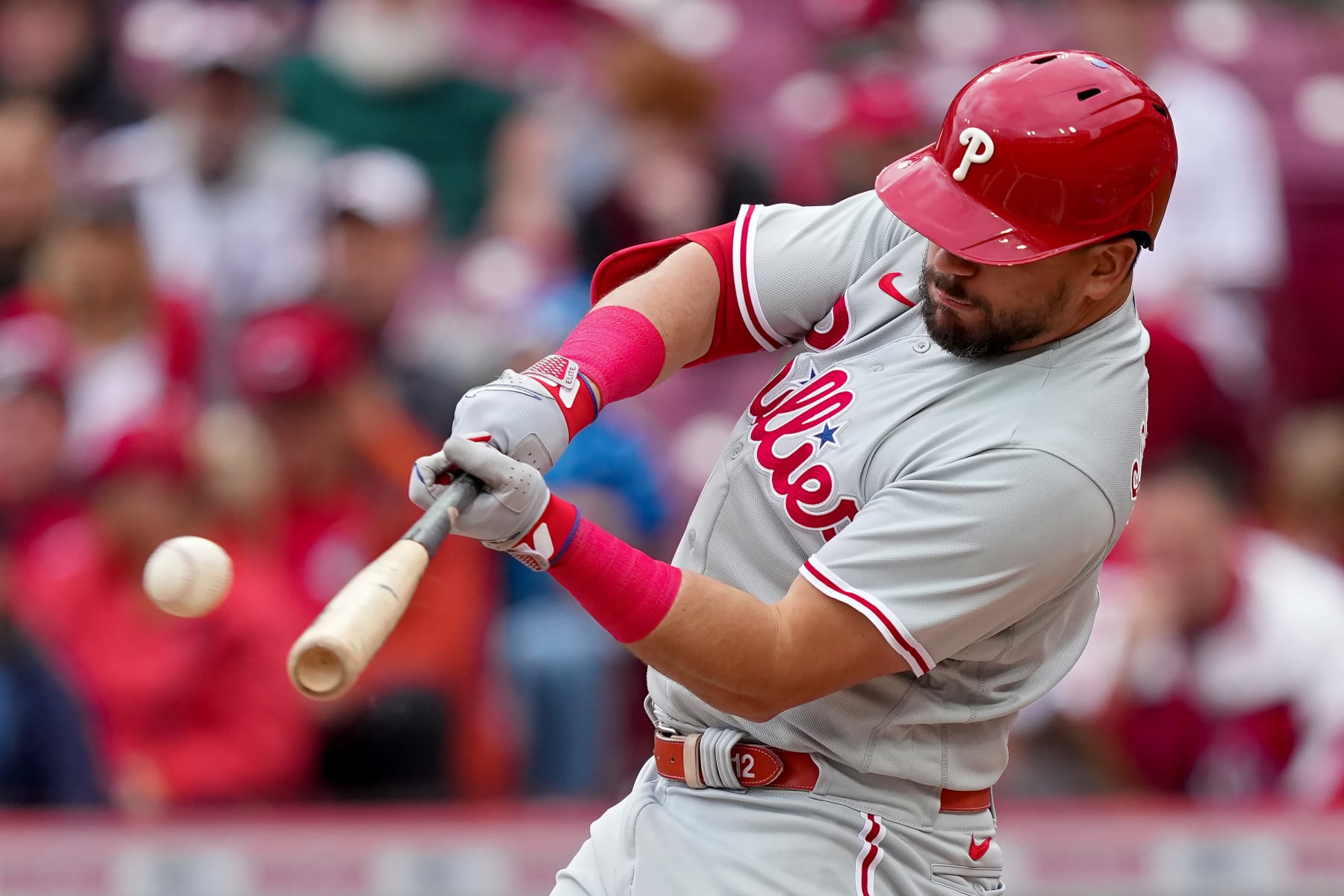 CINCINNATI, OHIO - APRIL 16: Kyle Schwarber #12 of the Philadelphia Phillies hits a double in the first inning against the Cincinnati Reds at Great American Ball Park on April 16, 2023 in Cincinnati, Ohio. (Photo by Dylan Buell/Getty Images)