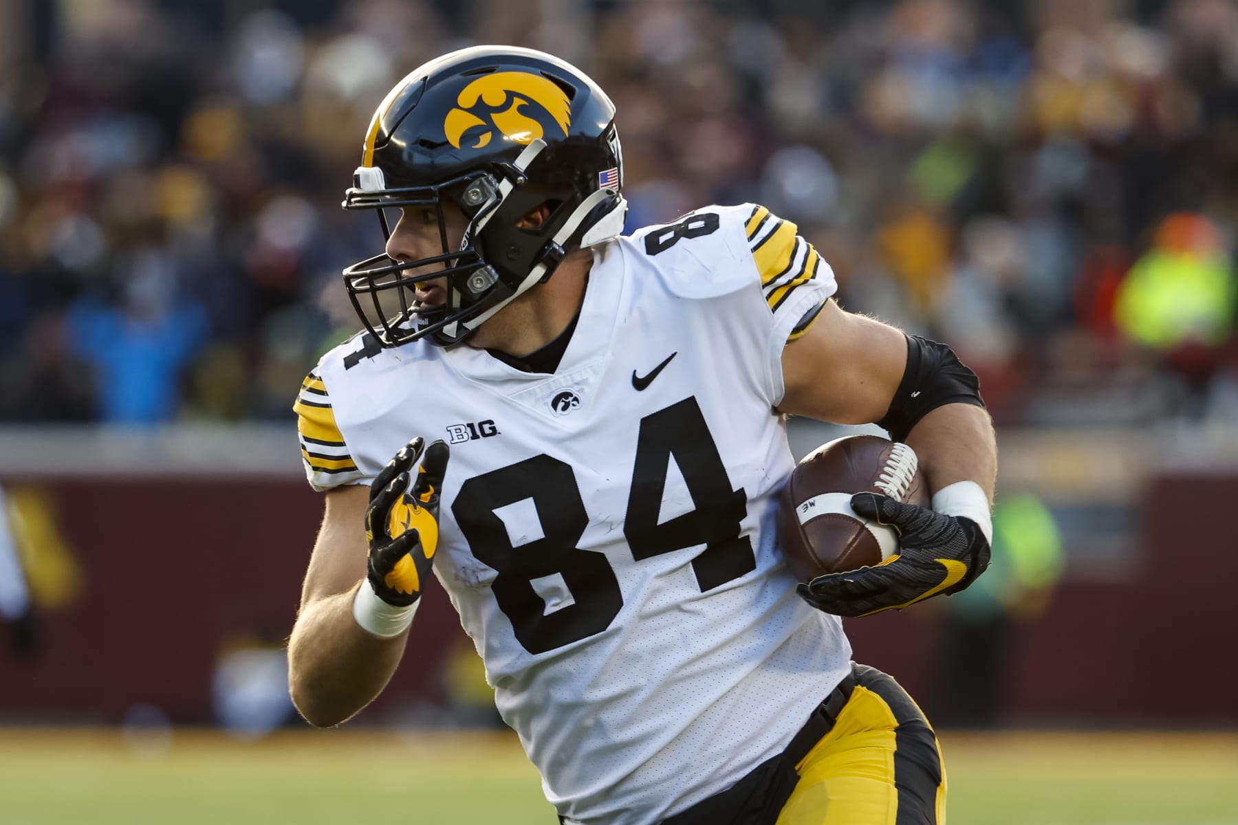 MINNEAPOLIS, MN - NOVEMBER 19: Sam LaPorta #84 of the Iowa Hawkeyes runs with the ball against the Minnesota Golden Gophers in the first quarter of the game at Huntington Bank Stadium on November 19, 2022 in Minneapolis, Minnesota. The Hawkeyes defeated the Golden Gophers 13-10. (Photo by David Berding/Getty Images)