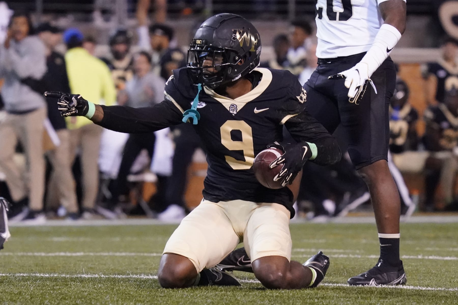 Wake Forest wide receiver A.T. Perry (9) celebrates after catching a pass against Army during the first half of an NCAA college football game in Winston-Salem, N.C., Saturday, Oct. 8, 2022. (AP Photo/Chuck Burton)