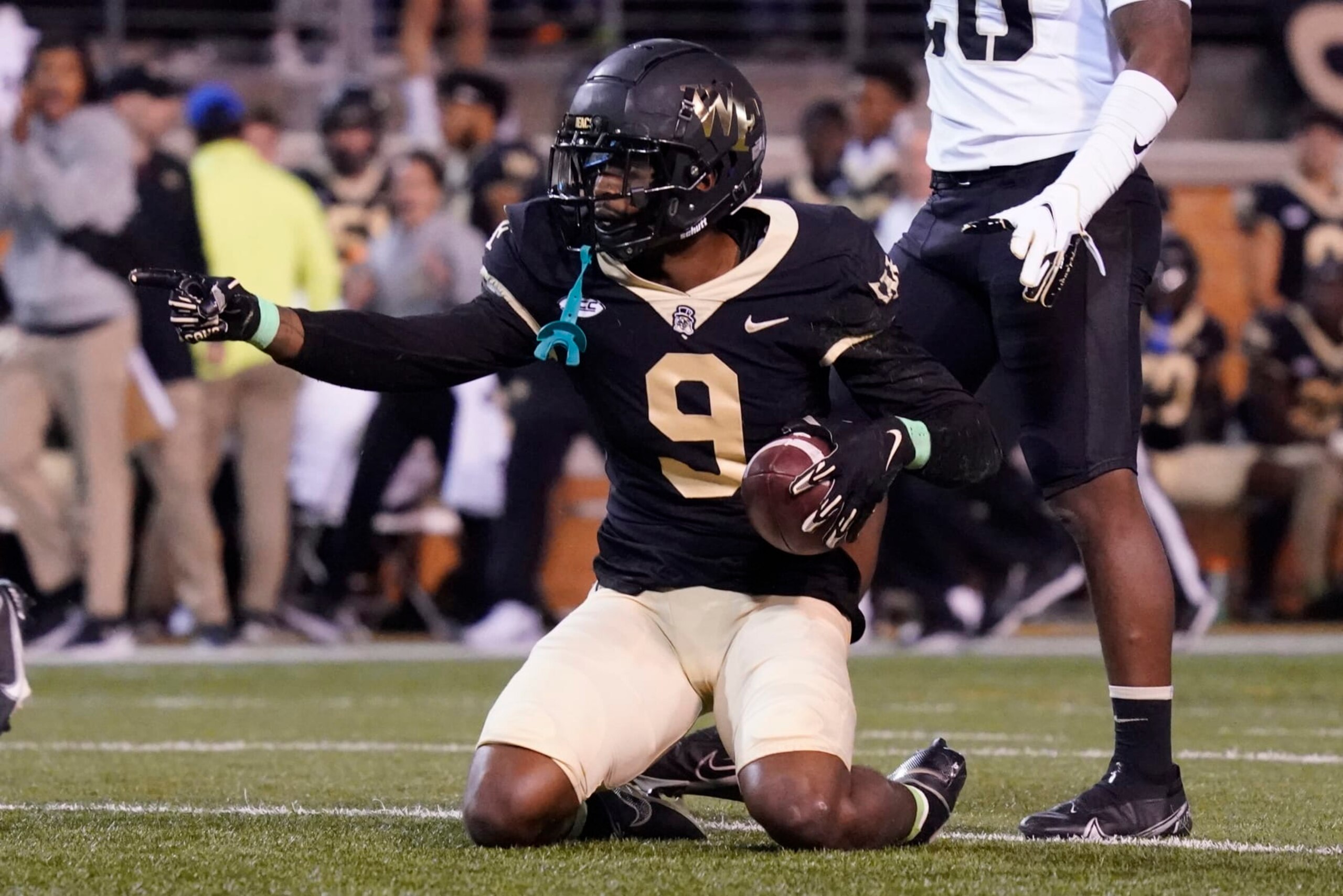 Wake Forest wide receiver A.T. Perry (9) celebrates after catching a pass against Army during the first half of an NCAA college football game in Winston-Salem, N.C., Saturday, Oct. 8, 2022. (AP Photo/Chuck Burton)