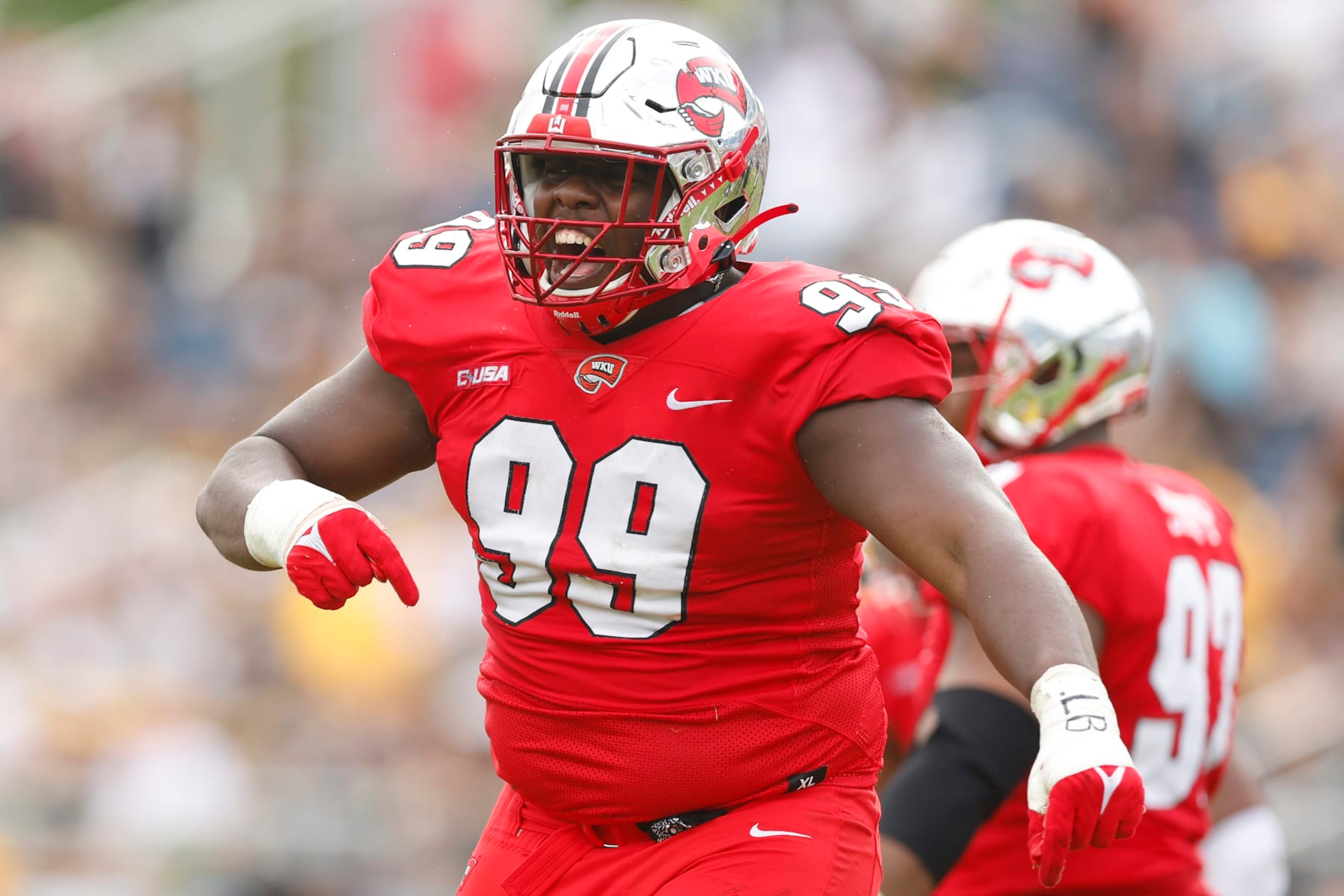 BOCA RATON, FLORIDA - DECEMBER 18: Brodric Martin #99 of the Western Kentucky Hilltoppers celebrates a sack against the Appalachian State Mountaineers during the second half of the RoofClaim.com Boca Raton Bowl at FAU Stadium on December 18, 2021 in Boca Raton, Florida. (Photo by Michael Reaves/Getty Images)