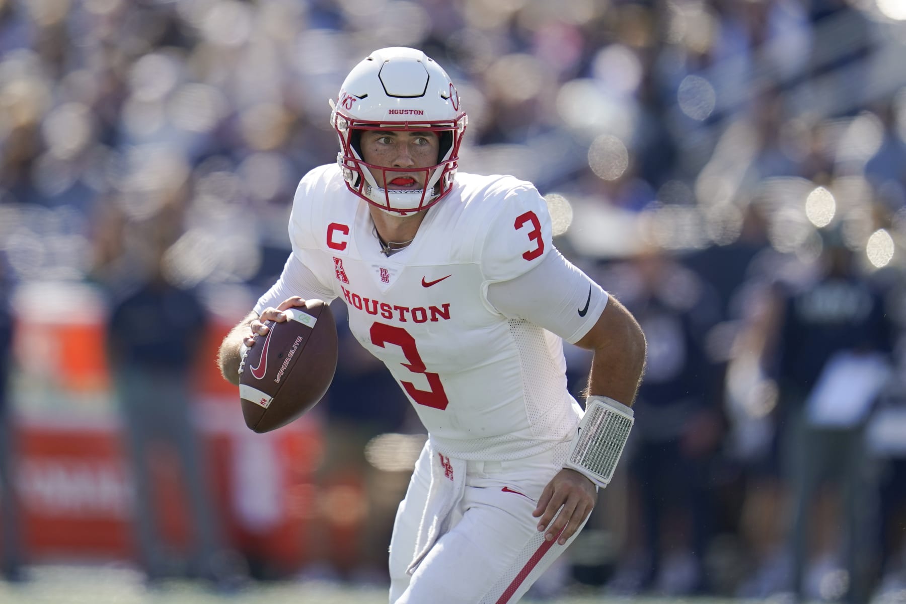 Houston quarterback Clayton Tune runs with the ball against Navy during the first half of an NCAA college football game, Saturday, Oct. 22, 2022, in Annapolis, Md. (AP Photo/Julio Cortez)