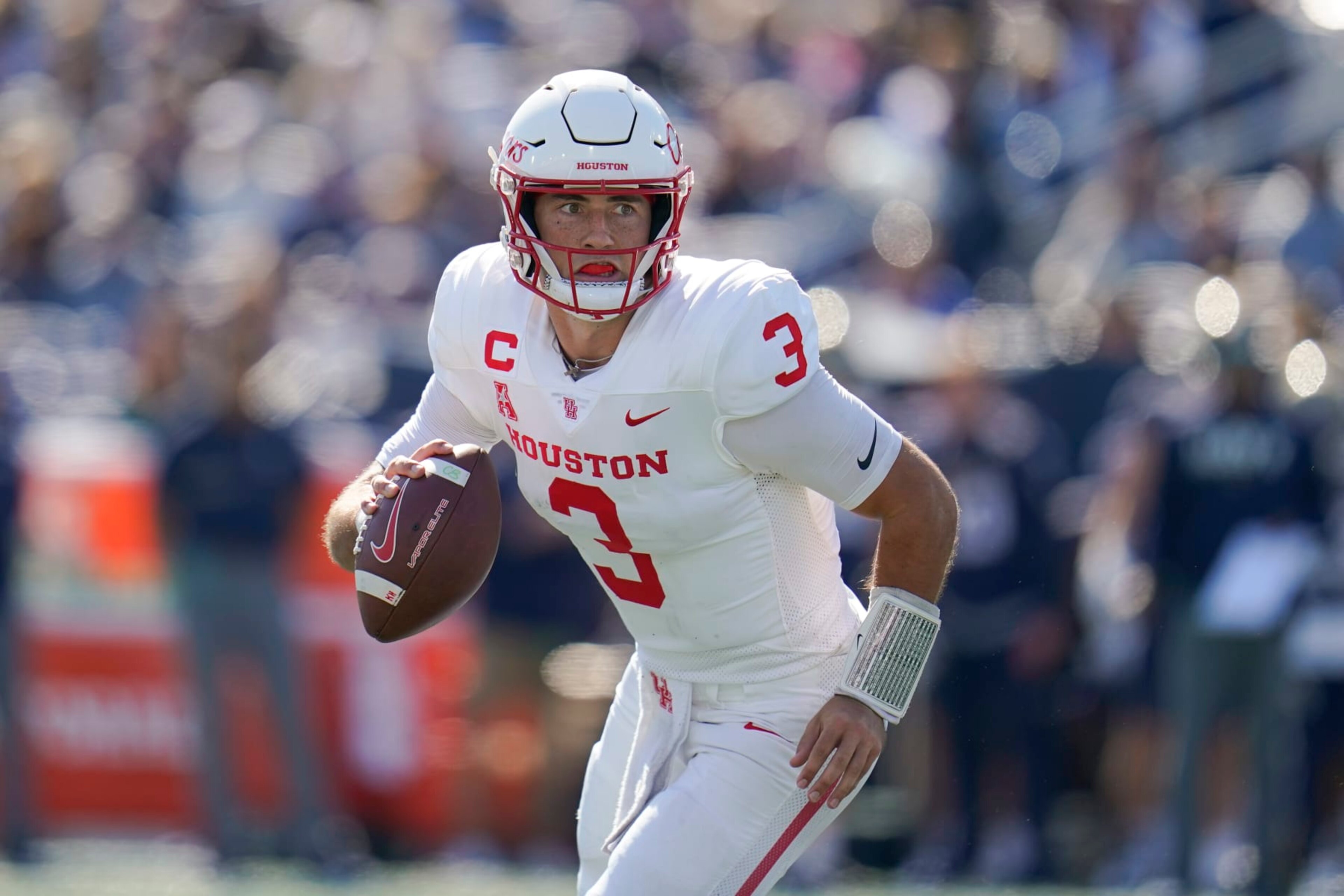 Houston quarterback Clayton Tune runs with the ball against Navy during the first half of an NCAA college football game, Saturday, Oct. 22, 2022, in Annapolis, Md. (AP Photo/Julio Cortez) Houston quarterback Clayton Tune runs with the ball against Navy during the first half of an NCAA college football game, Saturday, Oct. 22, 2022, in Annapolis, Md. (AP Photo/Julio Cortez)