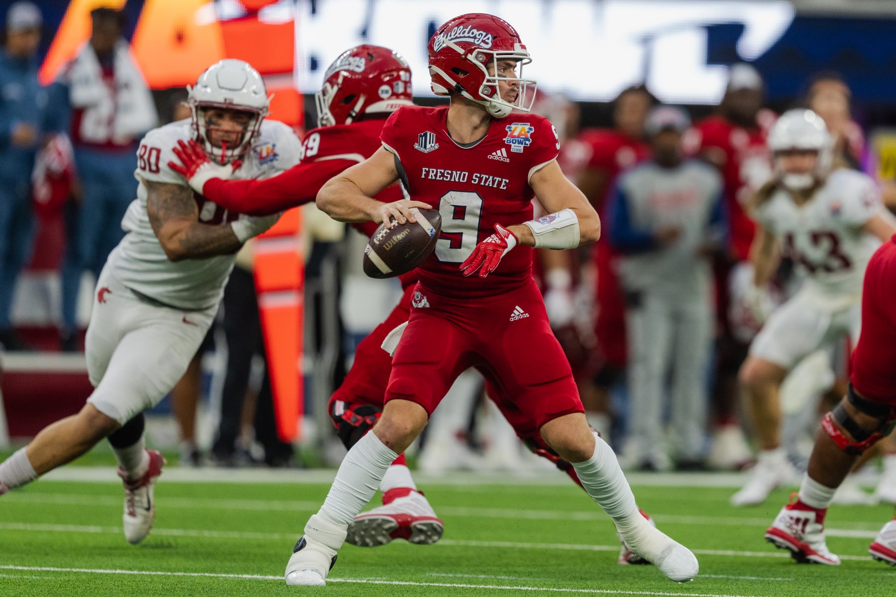 LOS ANGELS, CA - DECEMBER 17: Jake Haener #9 of Fresno State drops back in the pocket to throw a pass during the LA Bowl game between Washington State Cougars and Fresno State Bulldogs at SoFi Stadium on December 17, 2022 in Los Angels, California. (Photo by Jason Allen/ISI Photos/Getty Images)