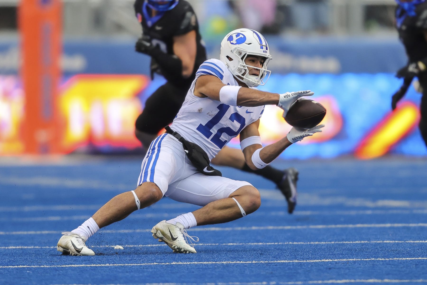 BYU wide receiver Puka Nacua (12) catches the ball against Boise State in the first half of an NCAA college football game, Saturday, Nov. 5, 2022, in Boise, Idaho. (AP Photo/Steve Conner)