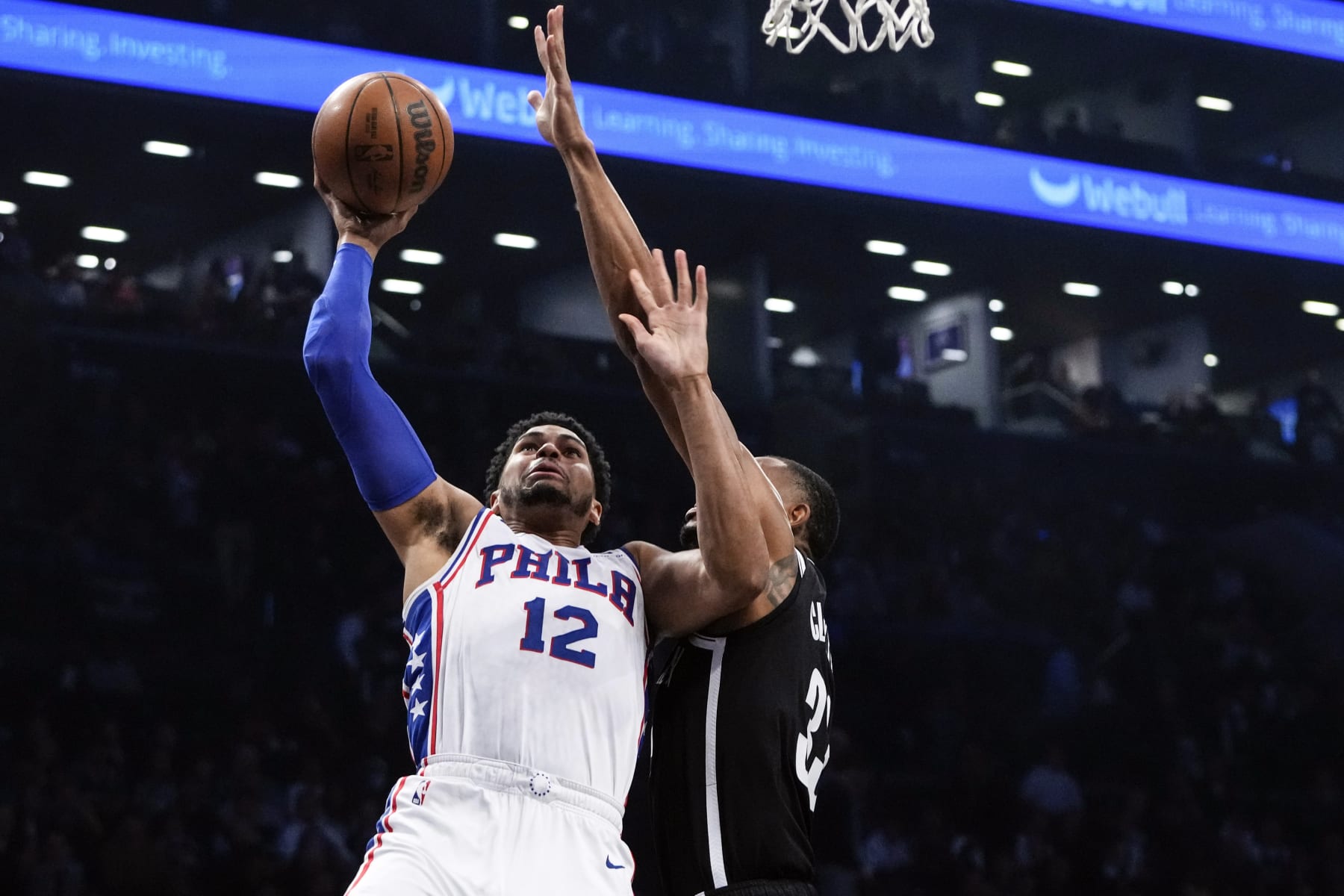 Philadelphia 76ers' Tobias Harris (12) shoots over Brooklyn Nets' Nic Claxton (33) during the first half of Game 4 in an NBA basketball first-round playoff series Saturday, April 22, 2023, in New York. (AP Photo/Frank Franklin II)