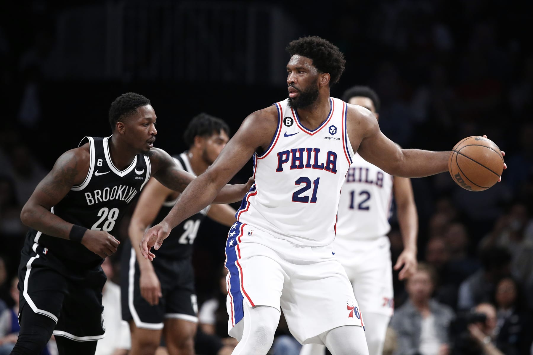 NEW YORK, NEW YORK - APRIL 20: Joel Embiid #21 of the Philadelphia 76ers dribbles against Dorian Finney-Smith #28 of the Brooklyn Nets during the first half of Game Three of the Eastern Conference First Round Playoffs at Barclays Center on April 20, 2023 in the Brooklyn borough of New York City. NOTE TO USER: User expressly acknowledges and agrees that, by downloading and or using this photograph, User is consenting to the terms and conditions of the Getty Images License Agreement. (Photo by Sarah Stier/Getty Images)