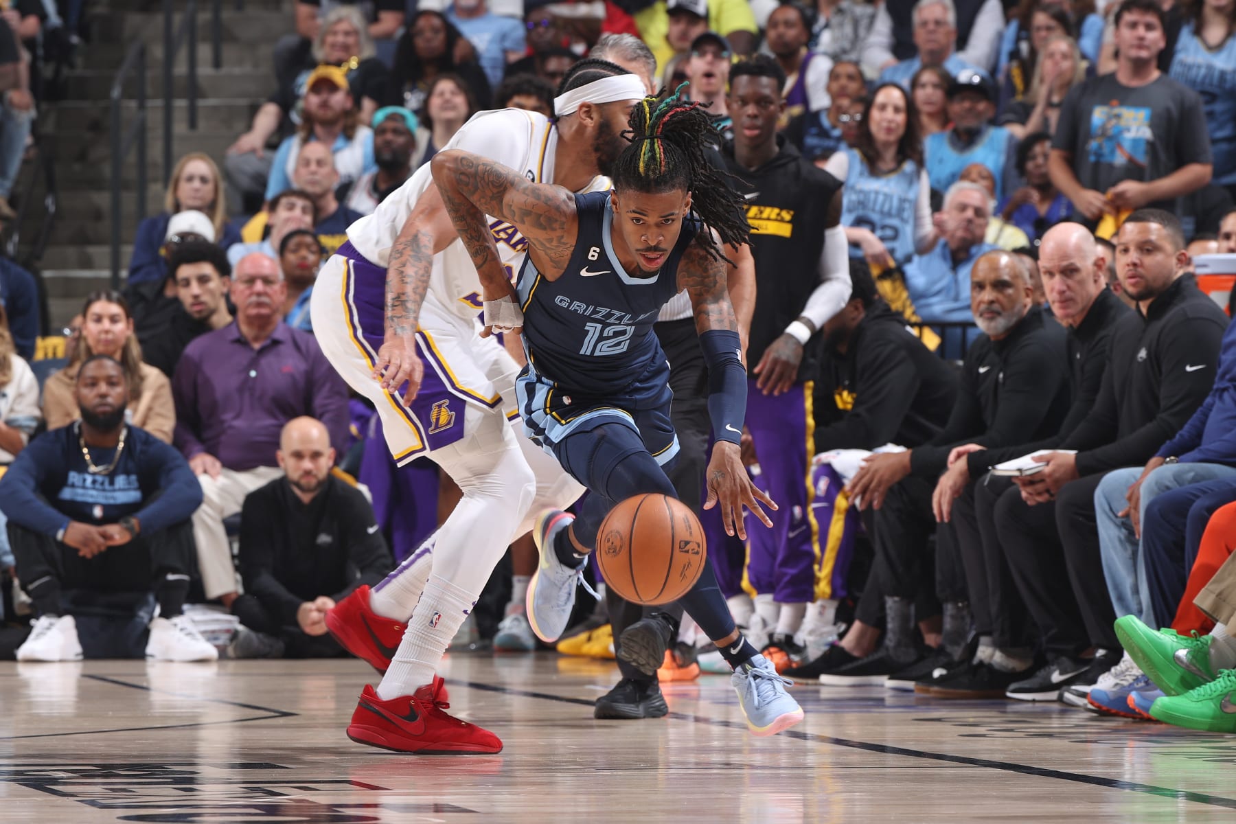 MEMPHIS, TN - APRIL 16: Ja Morant #12 of the Memphis Grizzlies steals the ball against the Los Angeles Lakers during Round 1 Game 1 of the NBA Playoffs on April 16, 2023 at FedExForum in Memphis, Tennessee. NOTE TO USER: User expressly acknowledges and agrees that, by downloading and or using this photograph, User is consenting to the terms and conditions of the Getty Images License Agreement. Mandatory Copyright Notice: Copyright 2023 NBAE (Photo by Joe Murphy/NBAE via Getty Images)