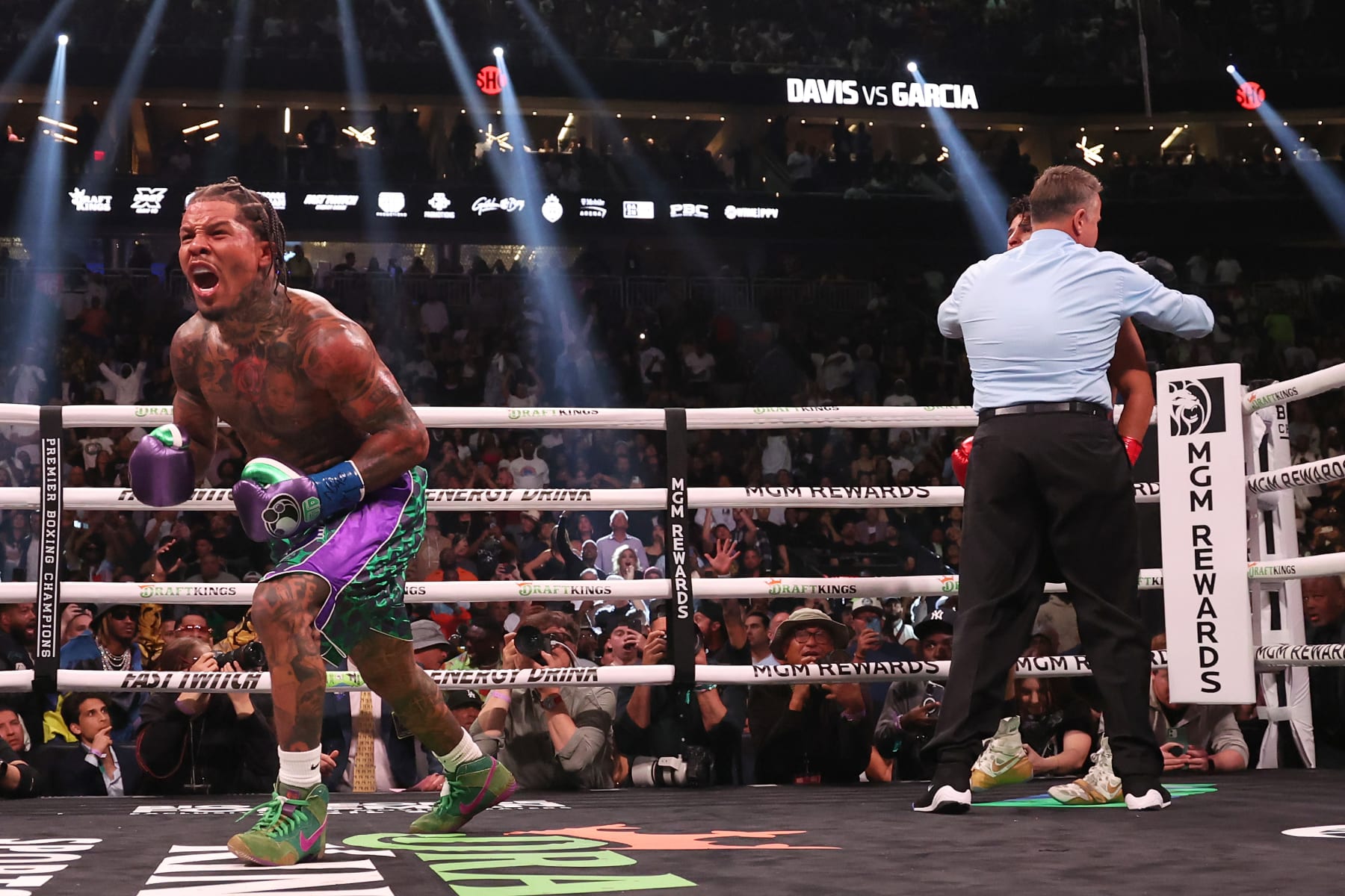 LAS VEGAS, NEVADA - APRIL 22: Gervonta Davis in the green and purple trunks reacts after defeating Ryan Garcia in the black trunks by knockout in the seventh round during their catchweight bout at T-Mobile Arena on April 22, 2023 in Las Vegas, Nevada. (Photo by Al Bello/Getty Images)