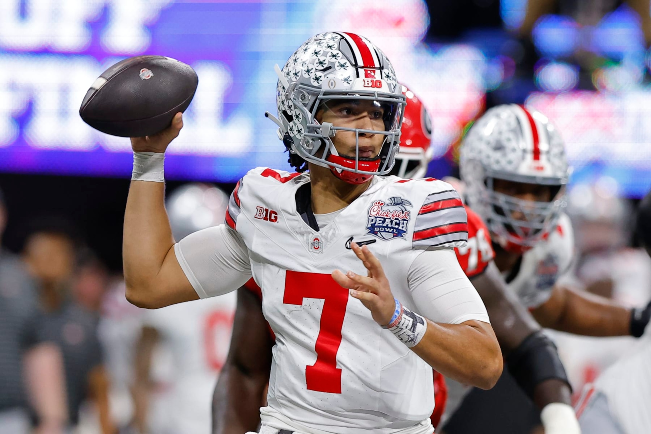 ATLANTA, GA - DECEMBER 31: C.J. Stroud #7 of the Ohio State Buckeyes drops back to pass during the first half against the Georgia Bulldogs in the Chick-fil-A Peach Bowl at Mercedes-Benz Stadium on December 31, 2022 in Atlanta, Georgia. (Photo by Todd Kirkland/Getty Images)
