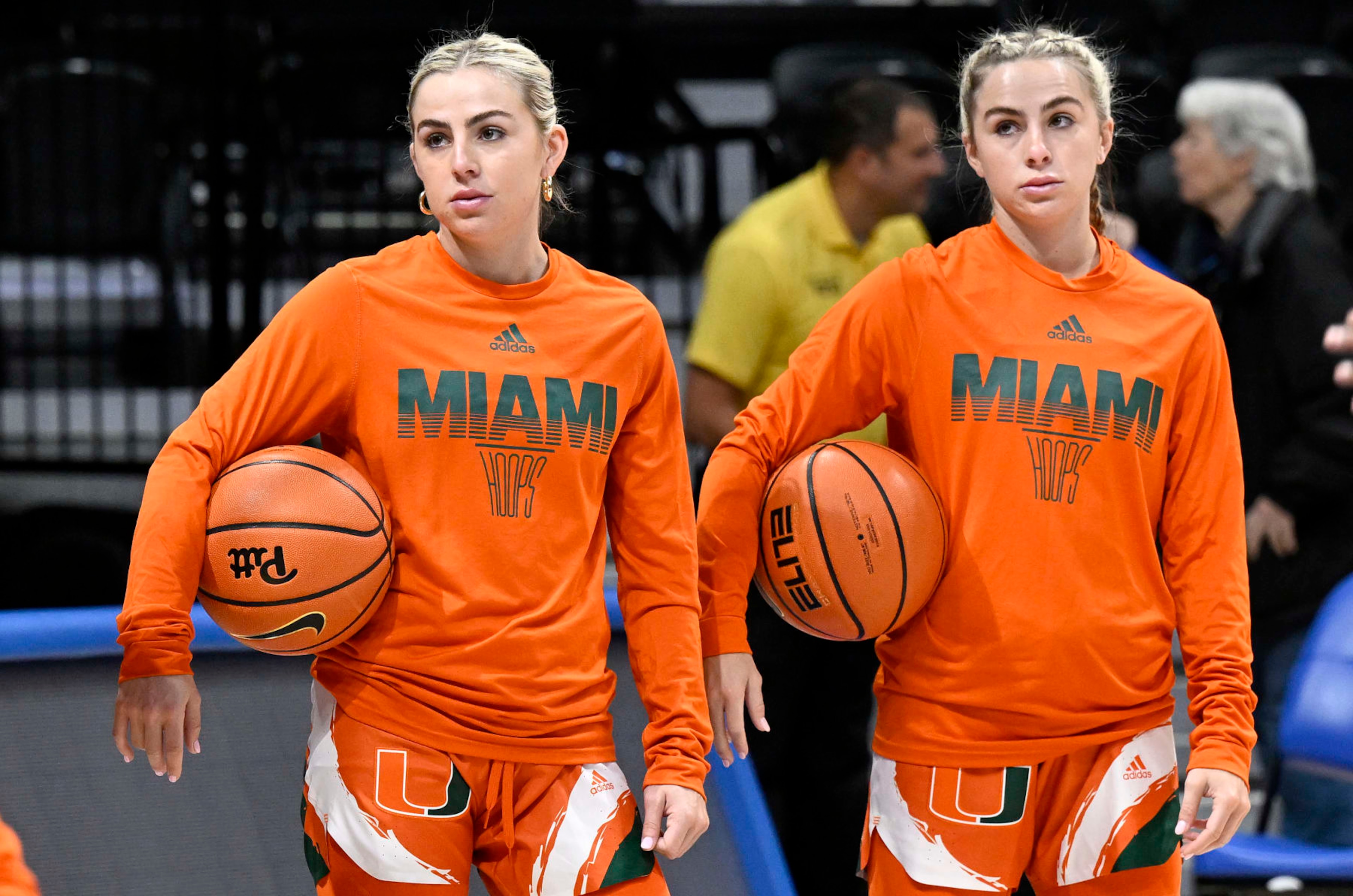 PITTSBURGH, PENNSYLVANIA - JANUARY 01: Haley Cavinder #14 (L) and Hanna Cavinder #15 (R) of the Miami Hurricanes warm up before the game against the Pittsburgh Panthers at Petersen Events Center on January 01, 2023 in Pittsburgh, Pennsylvania. (Photo by G Fiume/Getty Images)