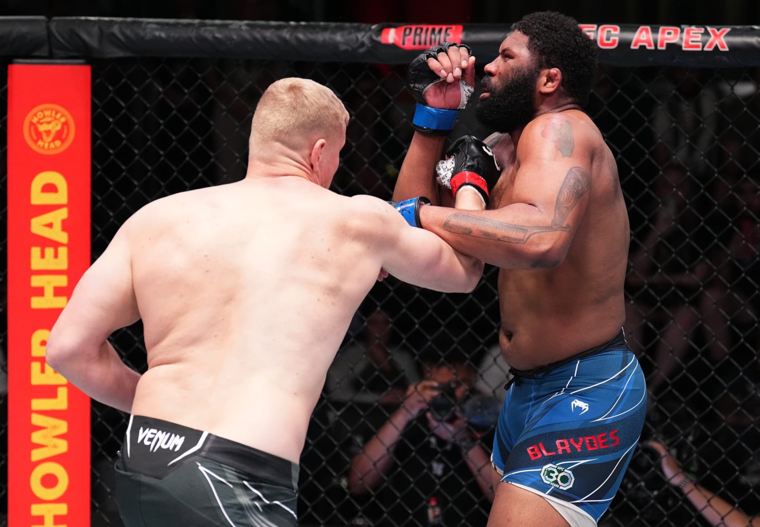 LAS VEGAS, NEVADA - APRIL 22: (L-R) Sergei Pavlovich of Russia punches Curtis Blaydes in a heavyweight fight during the UFC Fight Night event at UFC APEX on April 22, 2023 in Las Vegas, Nevada. (Photo by Chris Unger/Zuffa LLC via Getty Images)