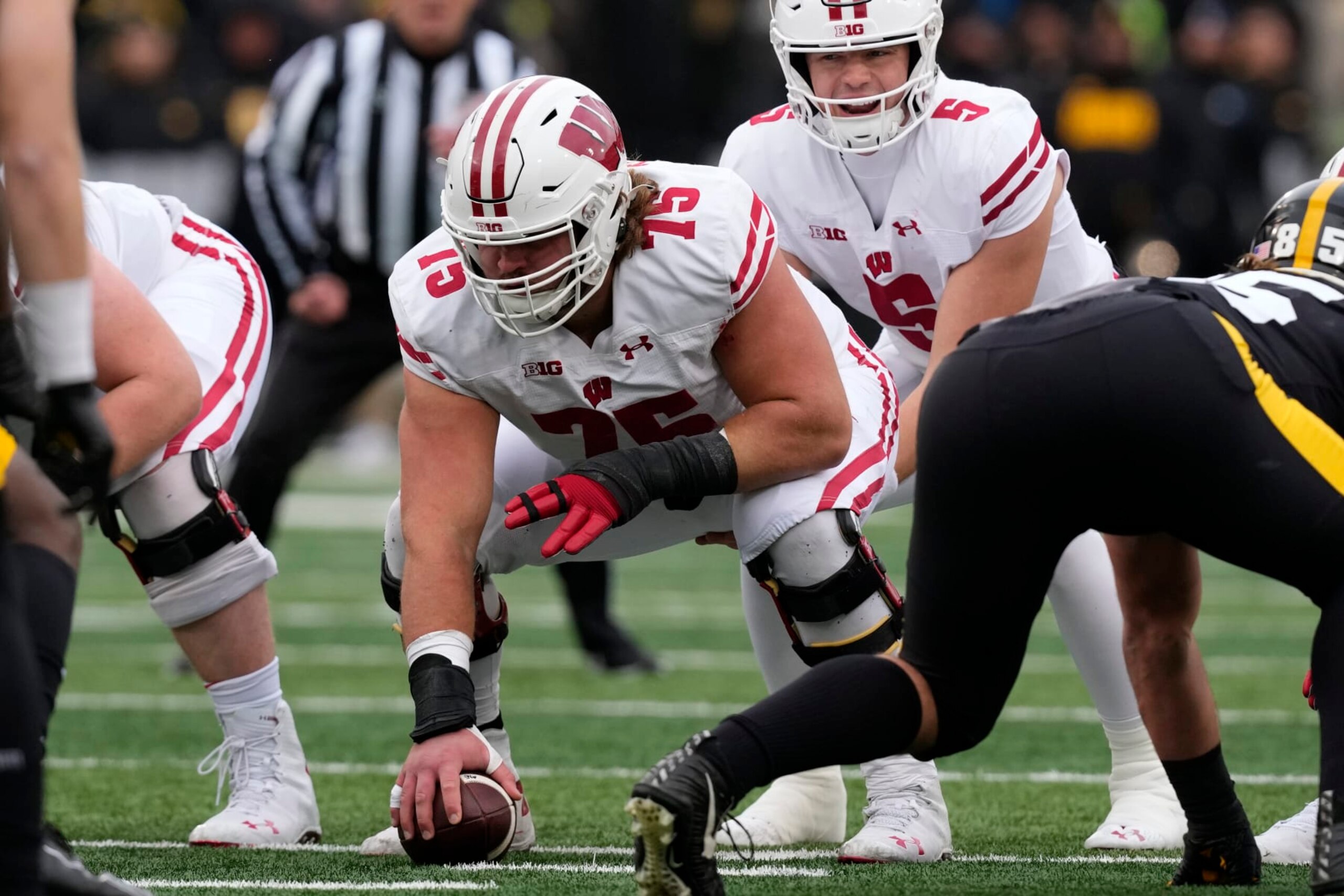 Wisconsin offensive lineman Joe Tippmann (75) gets set to snap the ball during the first half of an NCAA college football game against Iowa, Saturday, Nov. 12, 2022, in Iowa City, Iowa. (AP Photo/Charlie Neibergall) Wisconsin offensive lineman Joe Tippmann (75) gets set to snap the ball during the first half of an NCAA college football game against Iowa, Saturday, Nov. 12, 2022, in Iowa City, Iowa. (AP Photo/Charlie Neibergall)