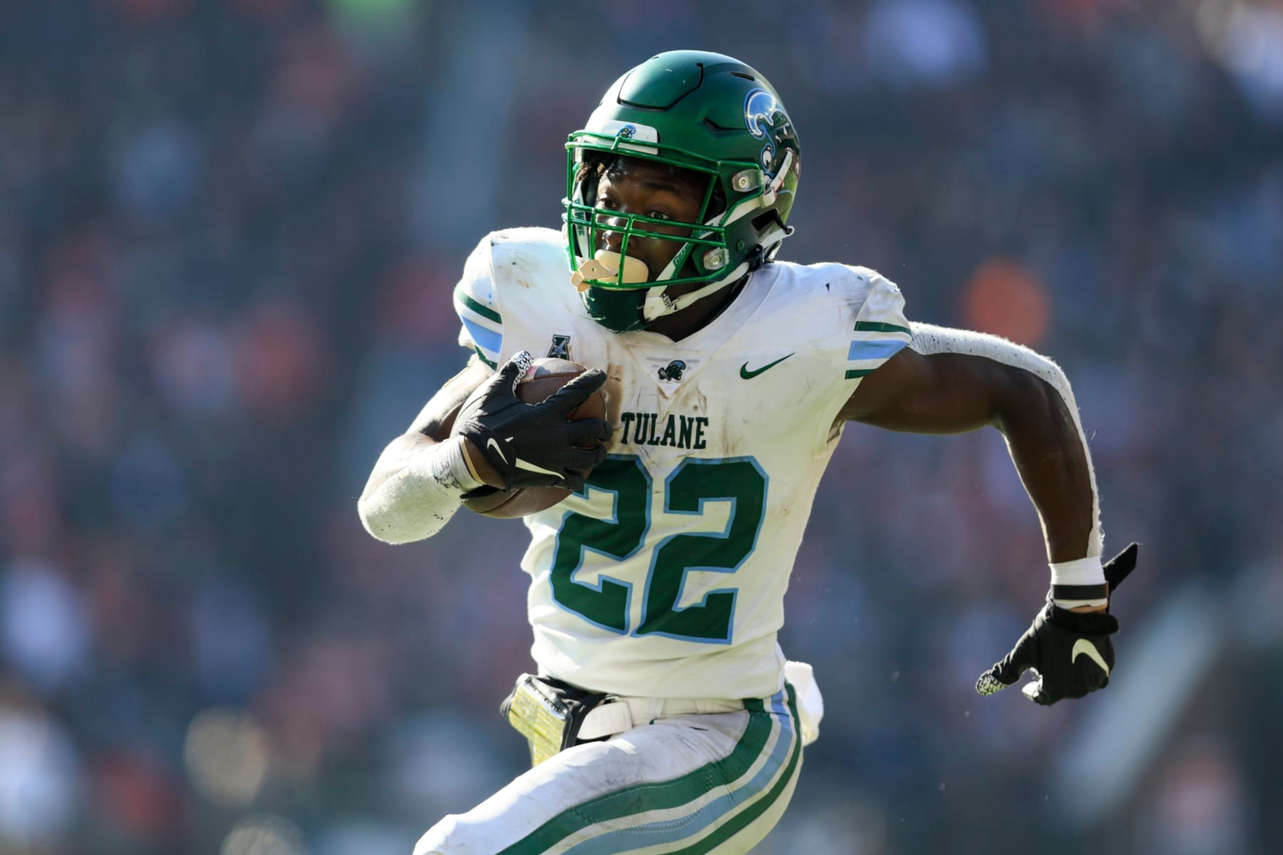 Tulane running back Tyjae Spears (22) carries the ball for a touchdown during an NCAA college football game against Cincinnati, Friday, Nov. 25, 2022, in Cincinnati. Tulane won 27-24. (AP Photo/Aaron Doster)