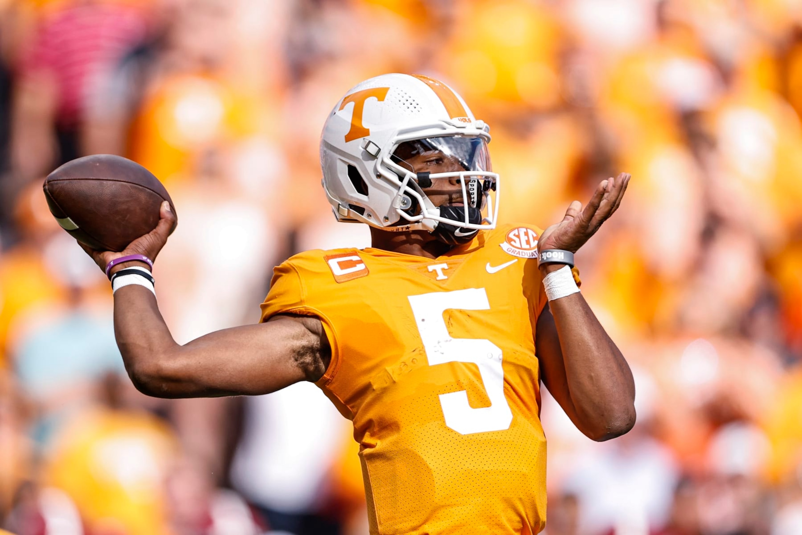 Tennessee quarterback Hendon Hooker (5) throws to a receiver during the first half of an NCAA college football game against Alabama Saturday, Oct. 15, 2022, in Knoxville, Tenn. (AP Photo/Wade Payne) Tennessee quarterback Hendon Hooker (5) throws to a receiver during the first half of an NCAA college football game against Alabama Saturday, Oct. 15, 2022, in Knoxville, Tenn. (AP Photo/Wade Payne)