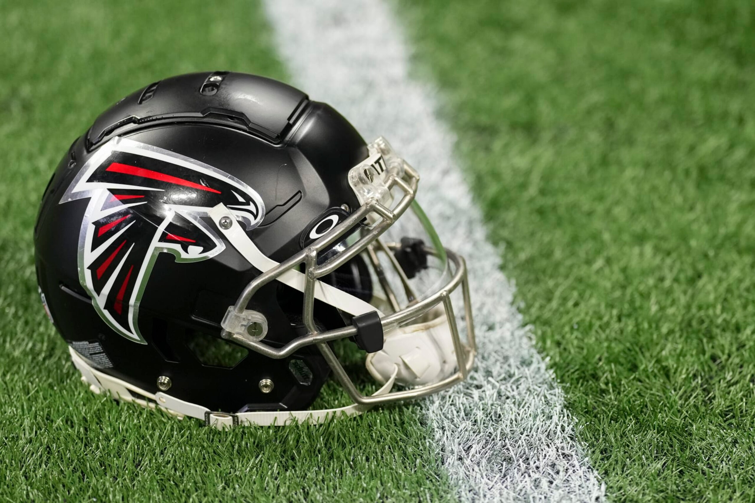 ATLANTA, GA - JANUARY 08: A close up view of an Atlanta Falcons helmet on the turf prior to the game against the Tampa Bay Buccaneers at Mercedes-Benz Stadium on January 8, 2023 in Atlanta, Georgia. (Photo by Cooper Neill/Getty Images) ATLANTA, GA - JANUARY 08: A close up view of an Atlanta Falcons helmet on the turf prior to the game against the Tampa Bay Buccaneers at Mercedes-Benz Stadium on January 8, 2023 in Atlanta, Georgia. (Photo by Cooper Neill/Getty Images)