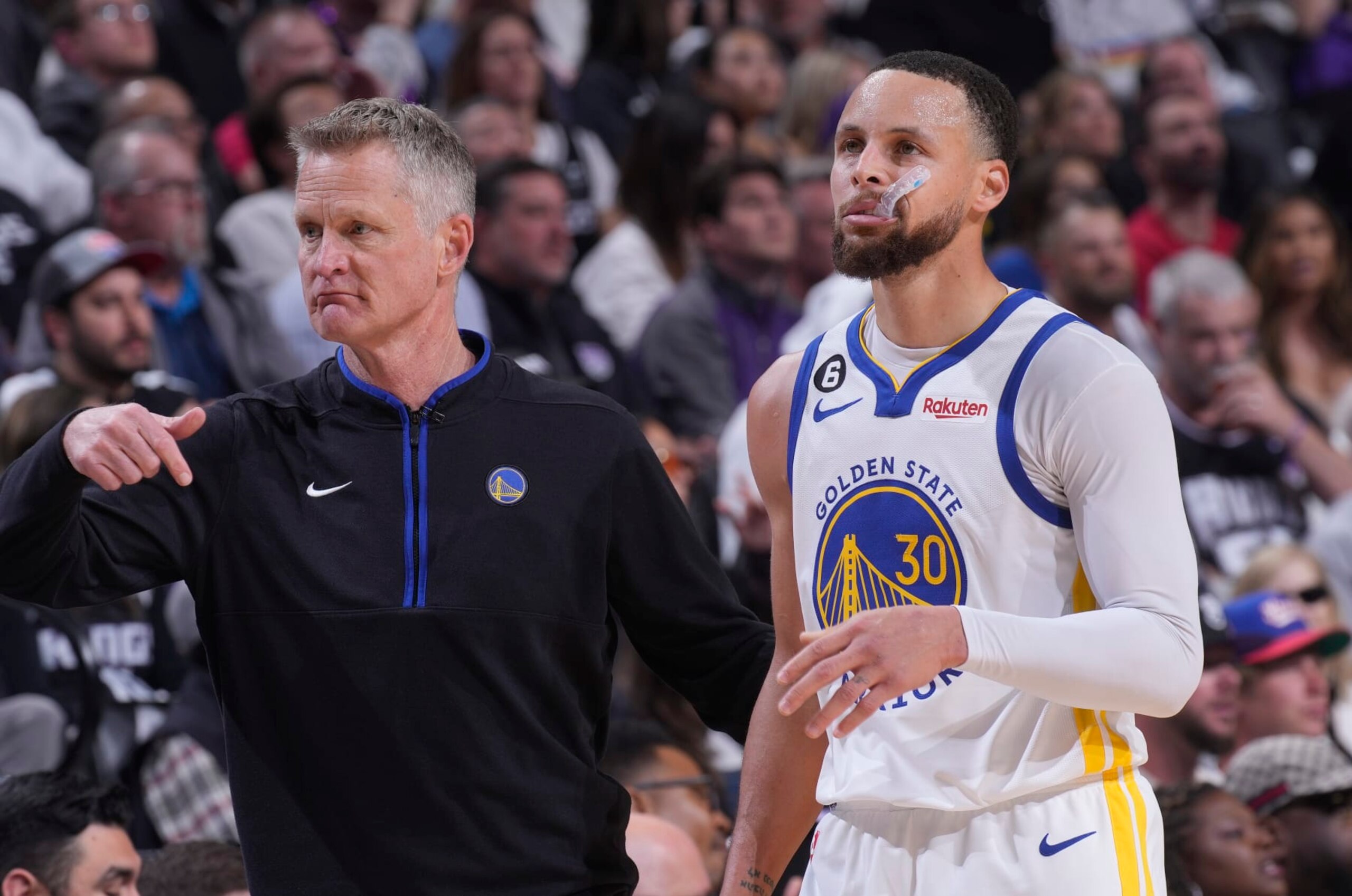 SACRAMENTO, CA - APRIL 17: Head Coach Steve Kerr and Stephen Curry #30 of the Golden State Warriors look on during the game against the Sacramento Kings during Round 1 Game 2 of the 2023 NBA Playoffs on April 17, 2023 at Golden 1 Center in Sacramento, California. NOTE TO USER: User expressly acknowledges and agrees that, by downloading and or using this photograph, User is consenting to the terms and conditions of the Getty Images Agreement. Mandatory Copyright Notice: Copyright 2023 NBAE (Photo by Rocky Widner/NBAE via Getty Images)