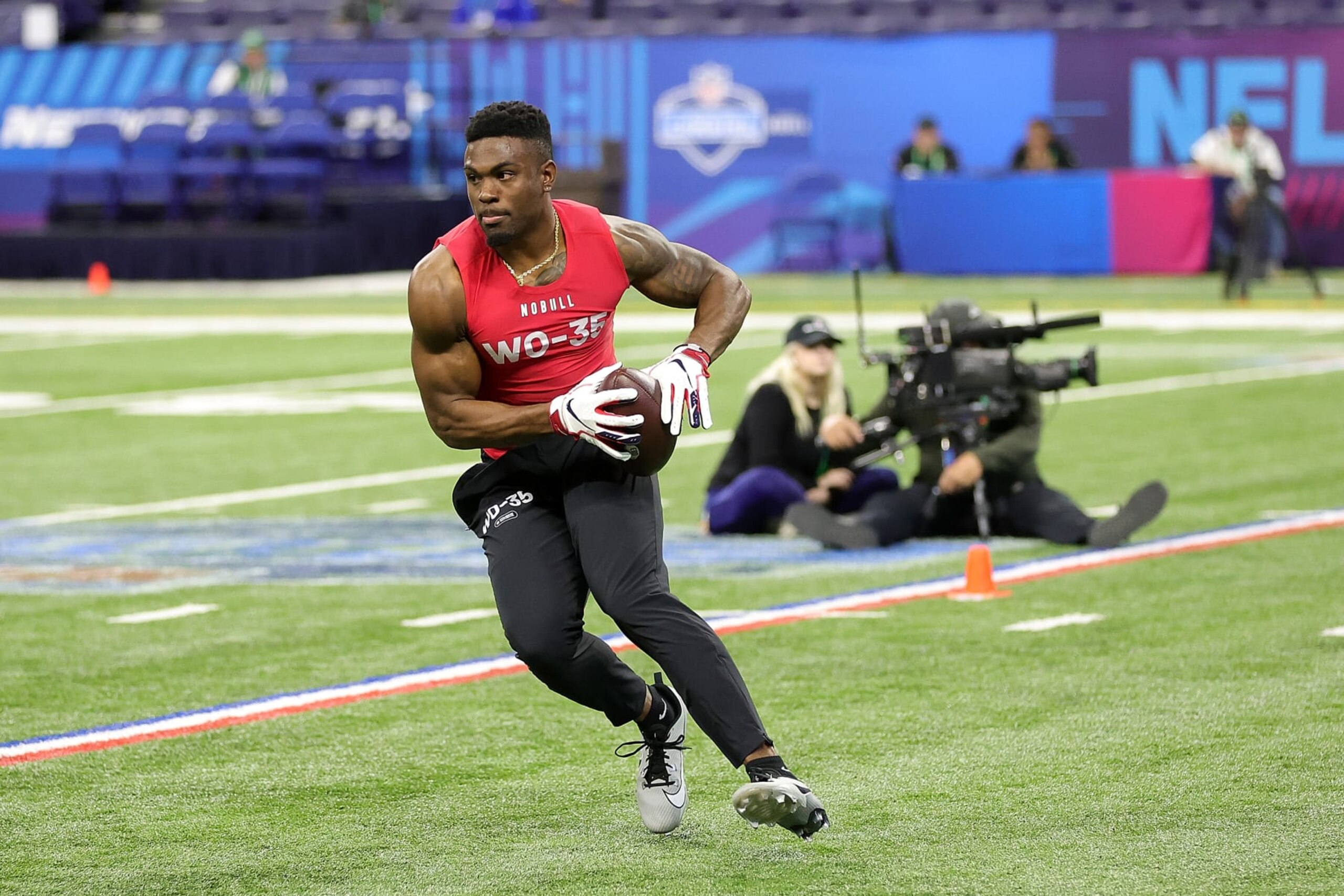 INDIANAPOLIS, INDIANA - MARCH 04: Jonathan Mingo of Mississippi participates in a drill during the NFL Combine at Lucas Oil Stadium on March 04, 2023 in Indianapolis, Indiana. (Photo by Stacy Revere/Getty Images)