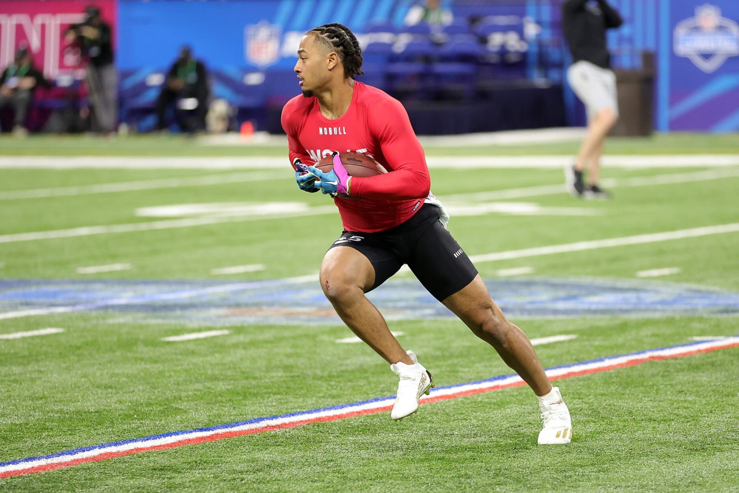INDIANAPOLIS, INDIANA - MARCH 04: Jaxon SmithâNjigba of Ohio State participates in a drill during the NFL Combine at Lucas Oil Stadium on March 04, 2023 in Indianapolis, Indiana. (Photo by Stacy Revere/Getty Images)