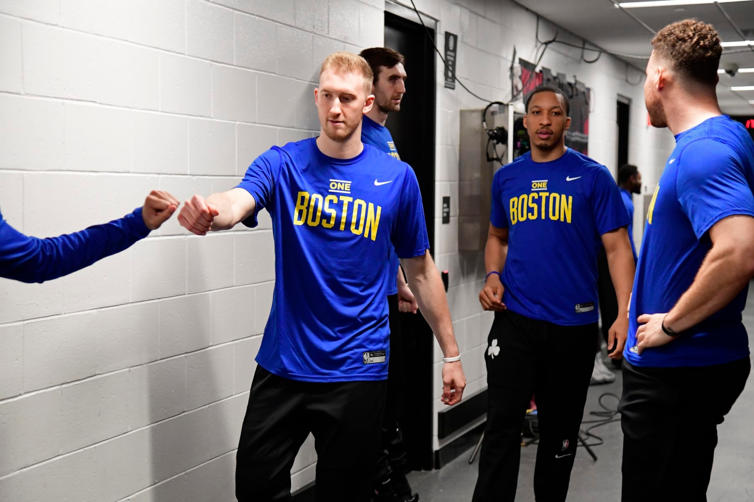 BOSTON, MA - APRIL 15: Sam Hauser #30 of the Boston Celtics high fives a teammate before the game During round one game one on April 15, 2023 at the TD Garden in Boston, Massachusetts. NOTE TO USER: User expressly acknowledges and agrees that, by downloading and or using this photograph, User is consenting to the terms and conditions of the Getty Images License Agreement. Mandatory Copyright Notice: Copyright 2023 NBAE  (Photo by Brian Babineau/NBAE via Getty Images)