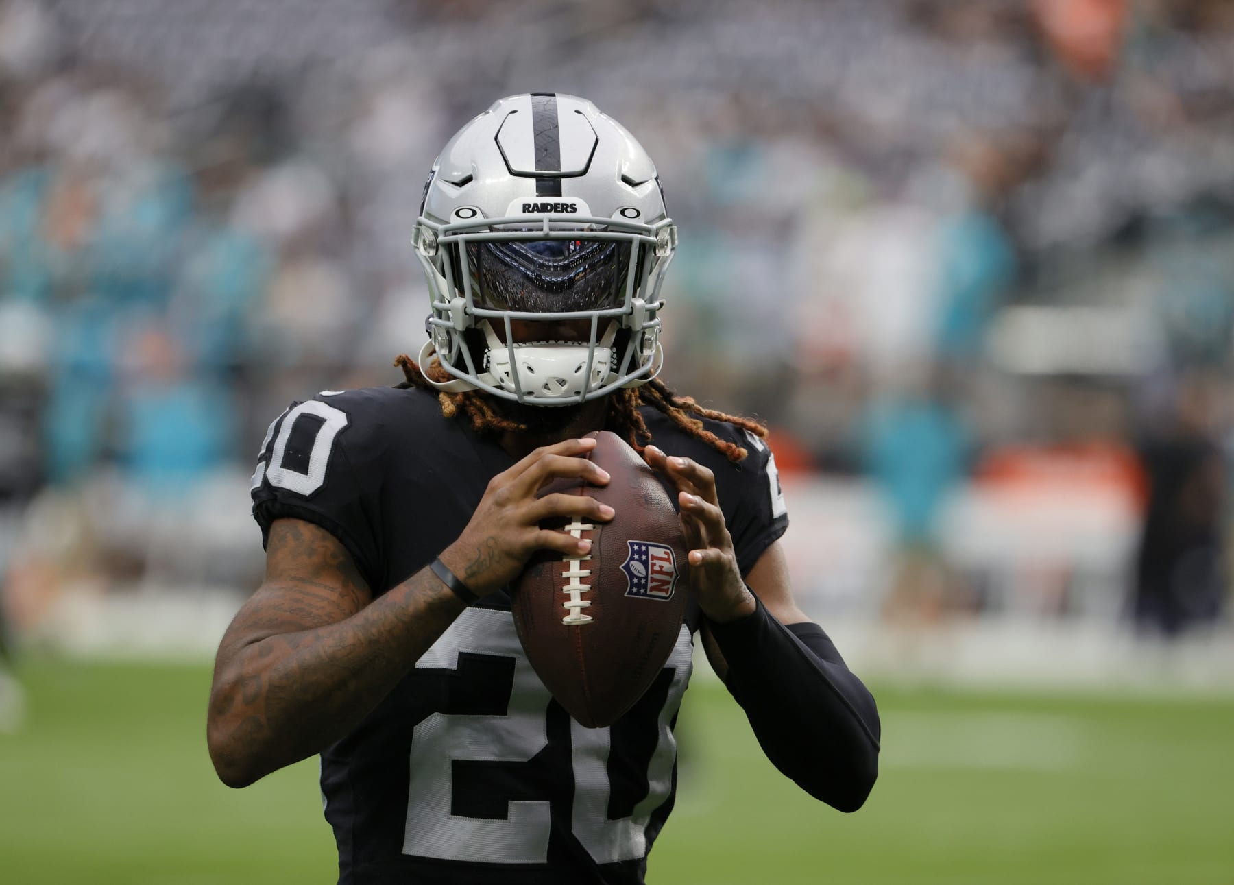 LAS VEGAS, NEVADA - SEPTEMBER 26:  Cornerback Damon Arnette #20 of the Las Vegas Raiders warms up before a game against the Miami Dolphins at Allegiant Stadium on September 26, 2021 in Las Vegas, Nevada. The Raiders defeated the Dolphins 31-28 in overtime.  (Photo by Ethan Miller/Getty Images)