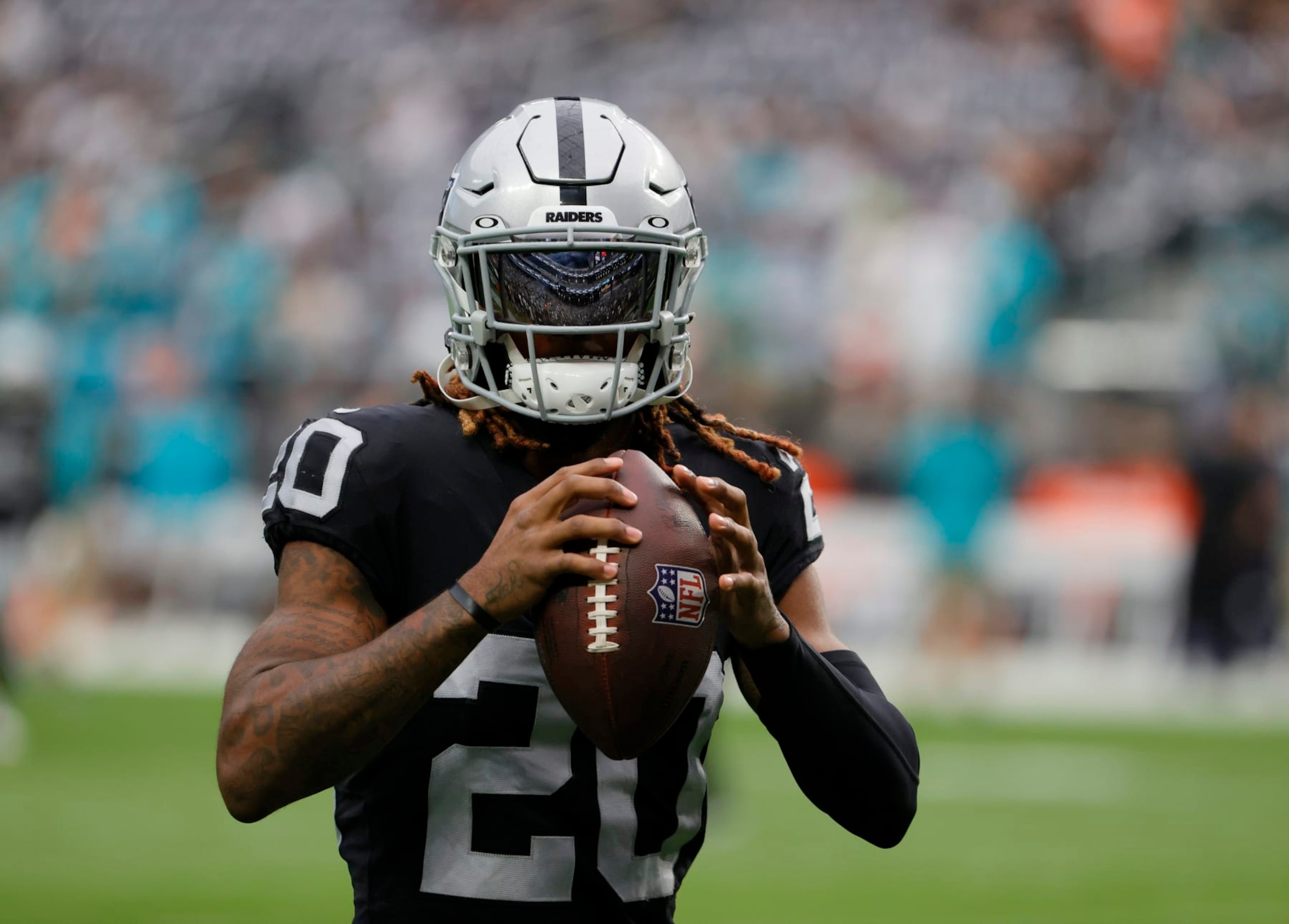 LAS VEGAS, NEVADA - SEPTEMBER 26:  Cornerback Damon Arnette #20 of the Las Vegas Raiders warms up before a game against the Miami Dolphins at Allegiant Stadium on September 26, 2021 in Las Vegas, Nevada. The Raiders defeated the Dolphins 31-28 in overtime.  (Photo by Ethan Miller/Getty Images)