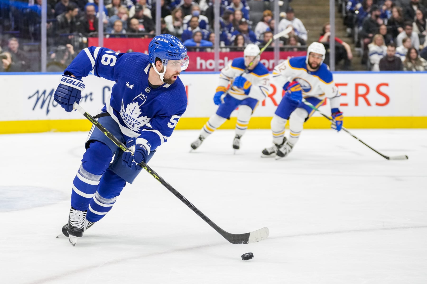 TORONTO, ON - MARCH 13: Erik Gustafsson #56 of the Toronto Maple Leafs plays the puck against the Buffalo Sabres during the first period at the Scotiabank Arena on March 13, 2023 in Toronto, Ontario, Canada. (Photo by Kevin Sousa/NHLI via Getty Images)