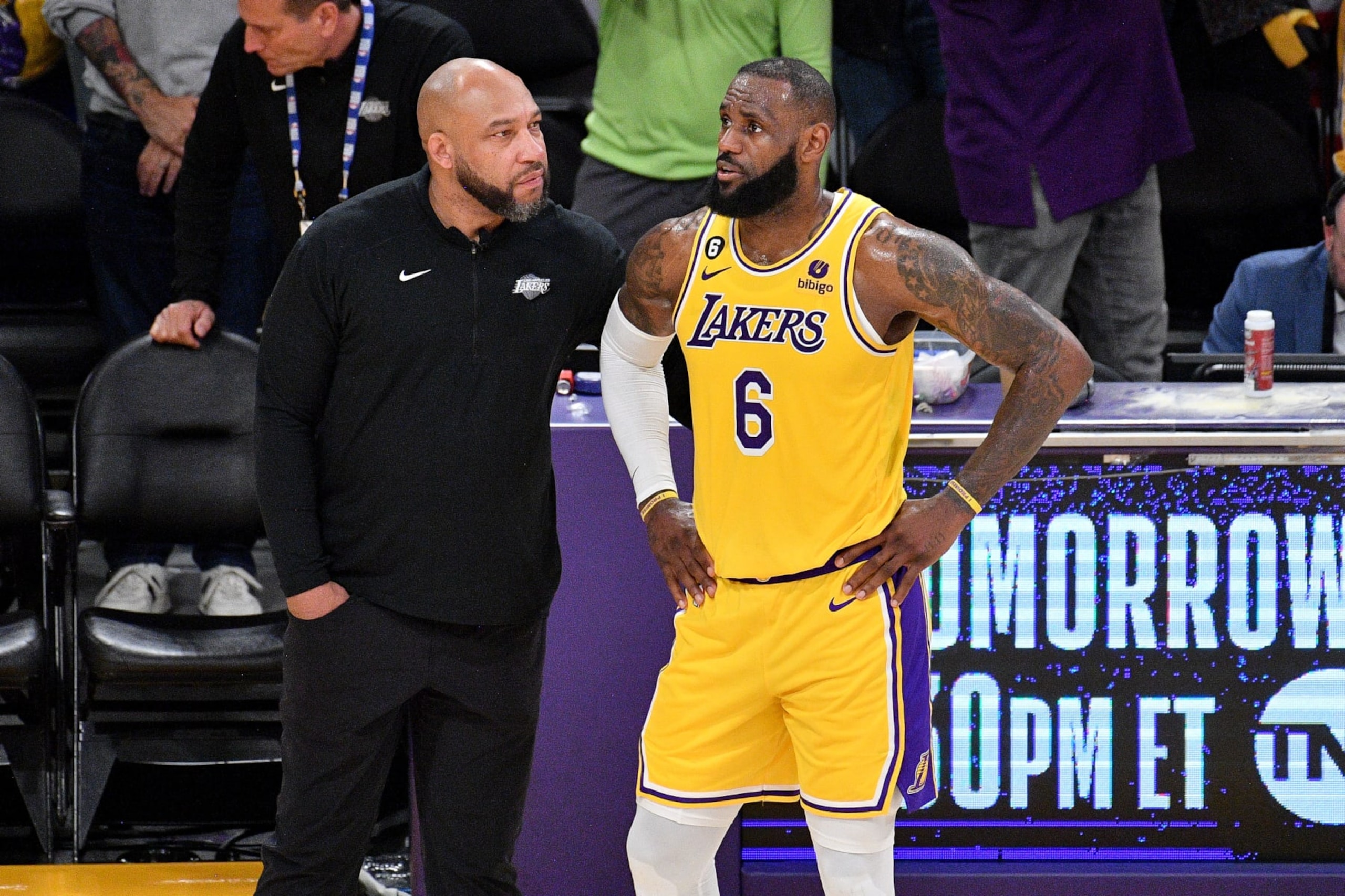 LOS ANGELES, CALIFORNIA - APRIL 24: LeBron James #6 of the Los Angeles Lakers talks to coach Darvin Ham during overtime of the game against the Memphis Grizzlies at Crypto.com Arena on April 24, 2023 in Los Angeles, California. NOTE TO USER: User expressly acknowledges and agrees that,  by downloading and or using this photograph,  User is consenting to the terms and conditions of the Getty Images License Agreement. (Photo by Allen Berezovsky/Getty Images)