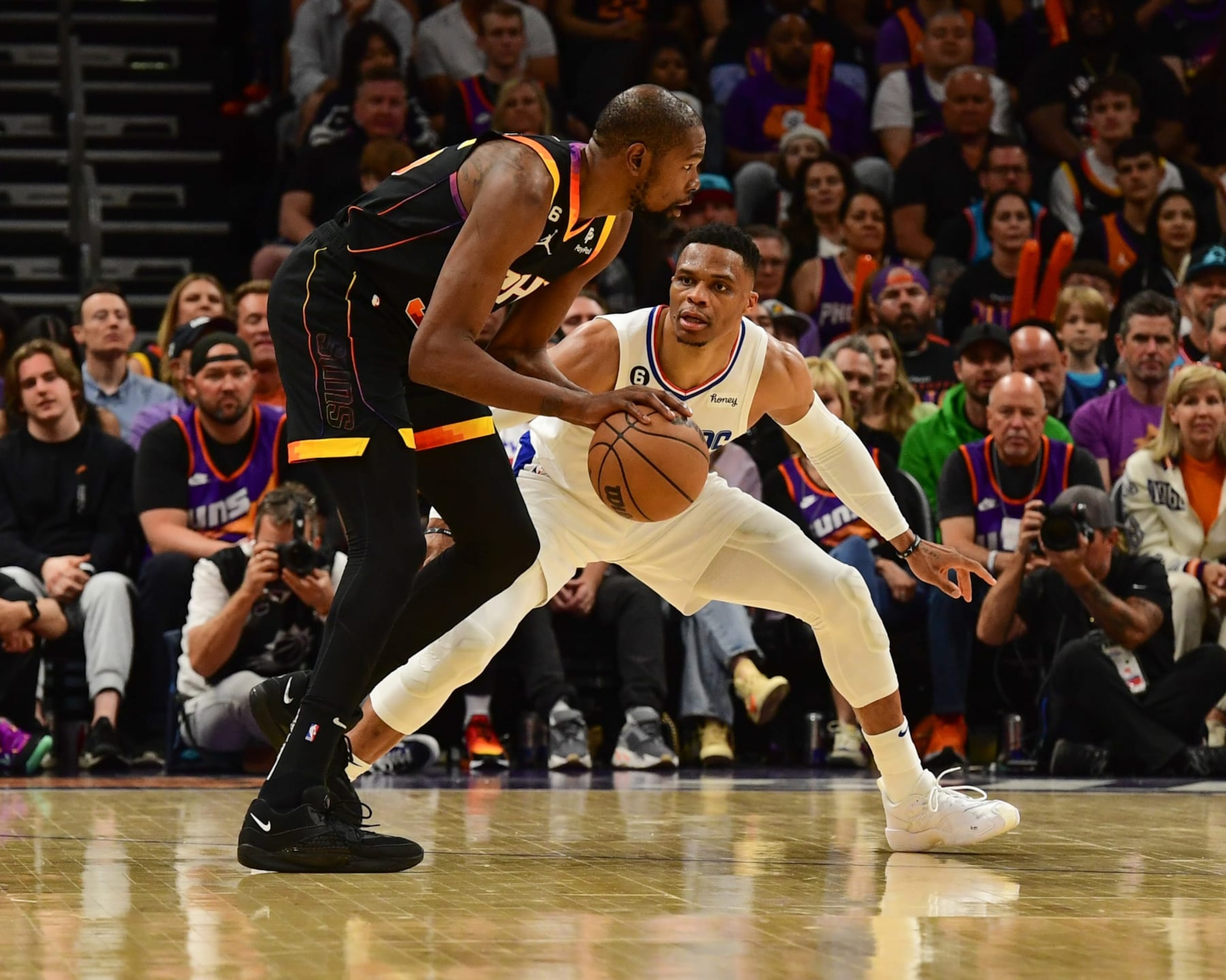 PHOENIX, AZ - APRIL 18:  Russell Westbrook #0 of the LA Clippers plays defense during the game  against Kevin Durant #35 of the Phoenix Suns during round one game two of the 2023 NBA Playoffs on April 18, 2023 at Footprint Center in Phoenix, Arizona. NOTE TO USER: User expressly acknowledges and agrees that, by downloading and or using this photograph, user is consenting to the terms and conditions of the Getty Images License Agreement. Mandatory Copyright Notice: Copyright 2023 NBAE (Photo by Kate Frese/NBAE via Getty Images)