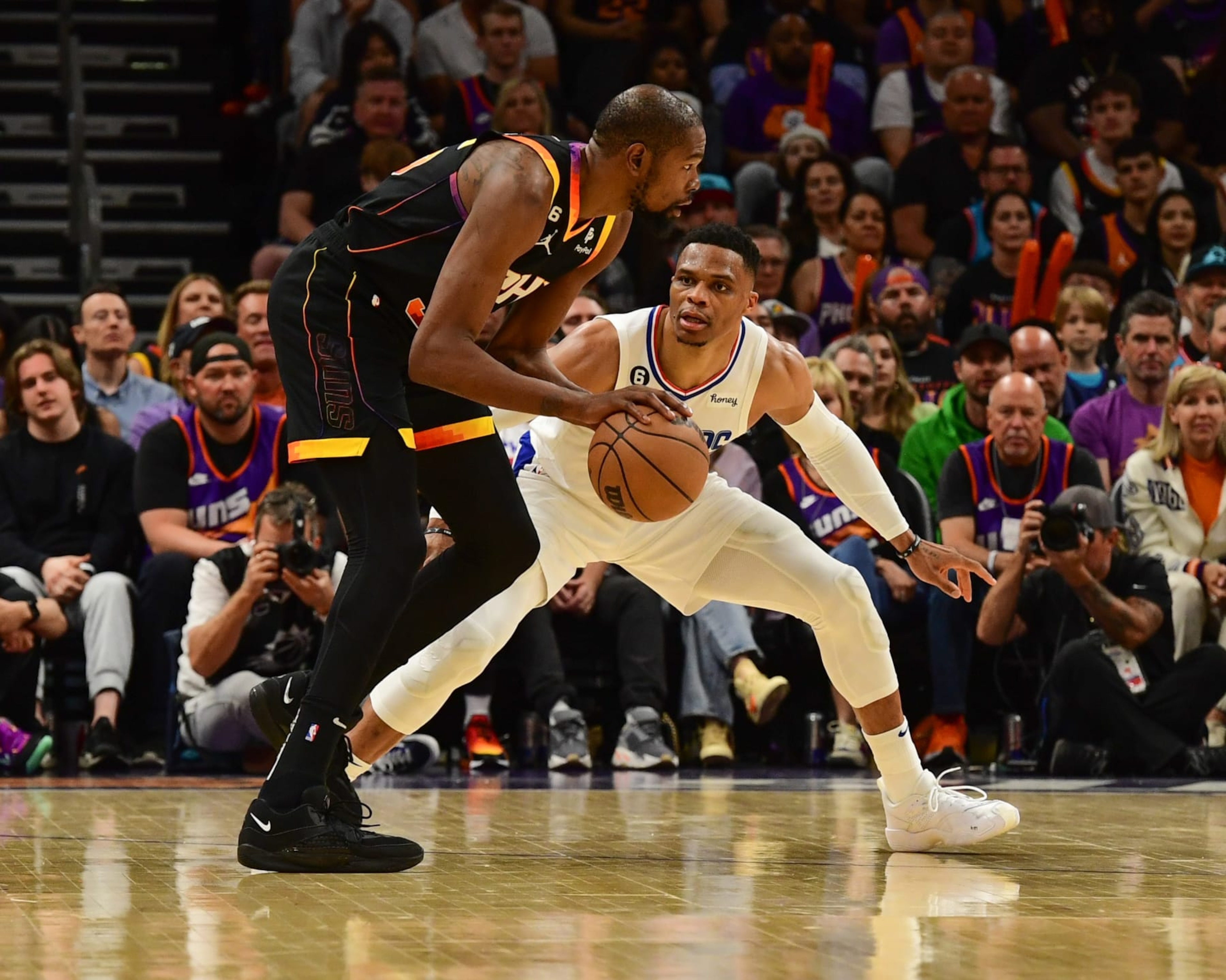 PHOENIX, AZ - APRIL 18: Russell Westbrook #0 of the LA Clippers plays defense during the game against Kevin Durant #35 of the Phoenix Suns during round one game two of the 2023 NBA Playoffs on April 18, 2023 at Footprint Center in Phoenix, Arizona. NOTE TO USER: User expressly acknowledges and agrees that, by downloading and or using this photograph, user is consenting to the terms and conditions of the Getty Images License Agreement. Mandatory Copyright Notice: Copyright 2023 NBAE (Photo by Kate Frese/NBAE via Getty Images) PHOENIX, AZ - APRIL 18: Russell Westbrook #0 of the LA Clippers plays defense during the game against Kevin Durant #35 of the Phoenix Suns during round one game two of the 2023 NBA Playoffs on April 18, 2023 at Footprint Center in Phoenix, Arizona. NOTE TO USER: User expressly acknowledges and agrees that, by downloading and or using this photograph, user is consenting to the terms and conditions of the Getty Images License Agreement. Mandatory Copyright Notice: Copyright 2023 NBAE (Photo by Kate Frese/NBAE via Getty Images)