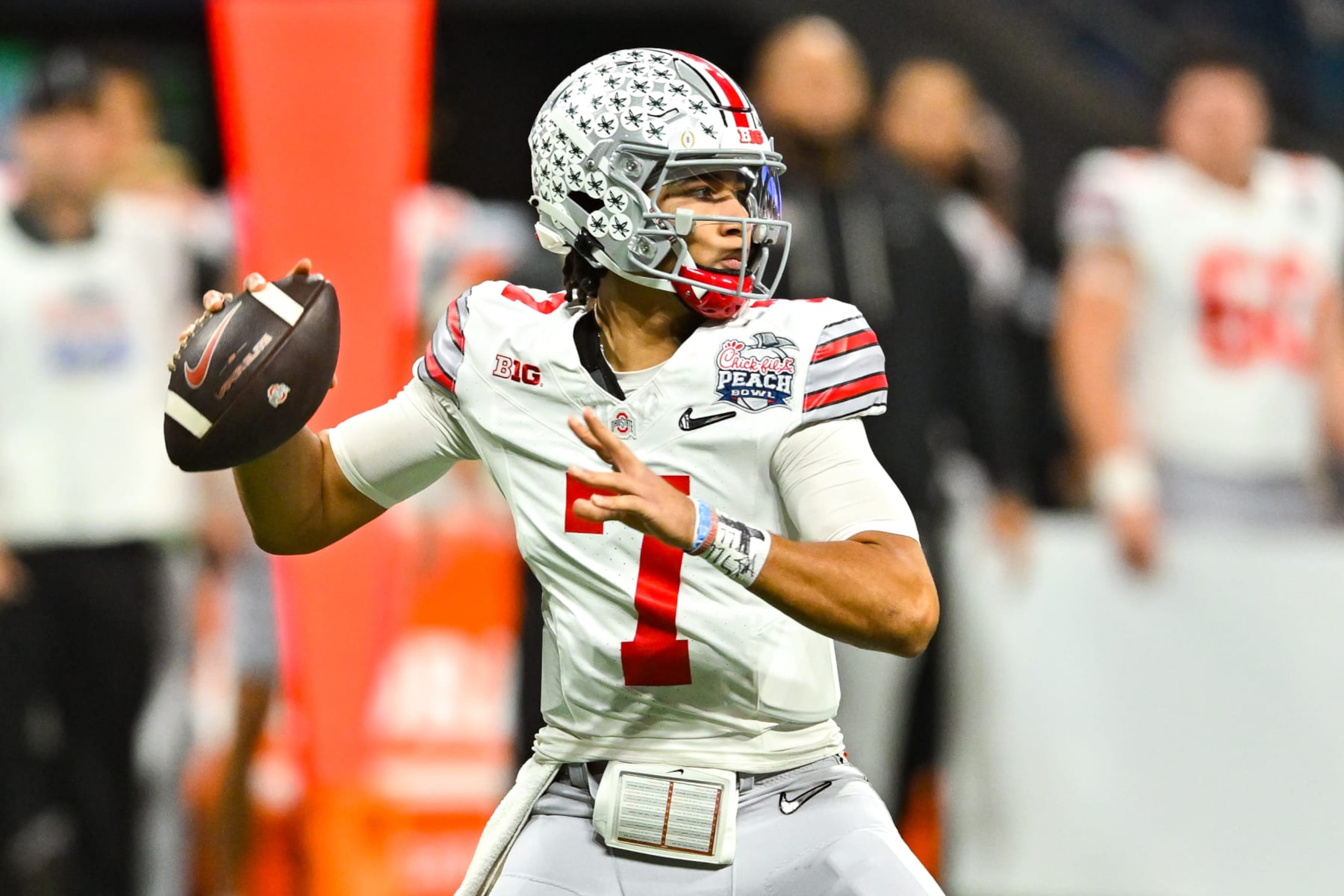 ATLANTA, GA DECEMBER 31: Ohio State quarterback C.J. Stroud (7) drops back to pass during the Chick-fil-A Peach Bowl college football playoff game between the Ohio State Buckeyes and the Georgia Bulldogs on December 31st, 2022 at Mercedes-Benz Stadium in Atlanta, GA. (Photo by Rich von Biberstein/Icon Sportswire via Getty Images) ATLANTA, GA DECEMBER 31: Ohio State quarterback C.J. Stroud (7) drops back to pass during the Chick-fil-A Peach Bowl college football playoff game between the Ohio State Buckeyes and the Georgia Bulldogs on December 31st, 2022 at Mercedes-Benz Stadium in Atlanta, GA. (Photo by Rich von Biberstein/Icon Sportswire via Getty Images)