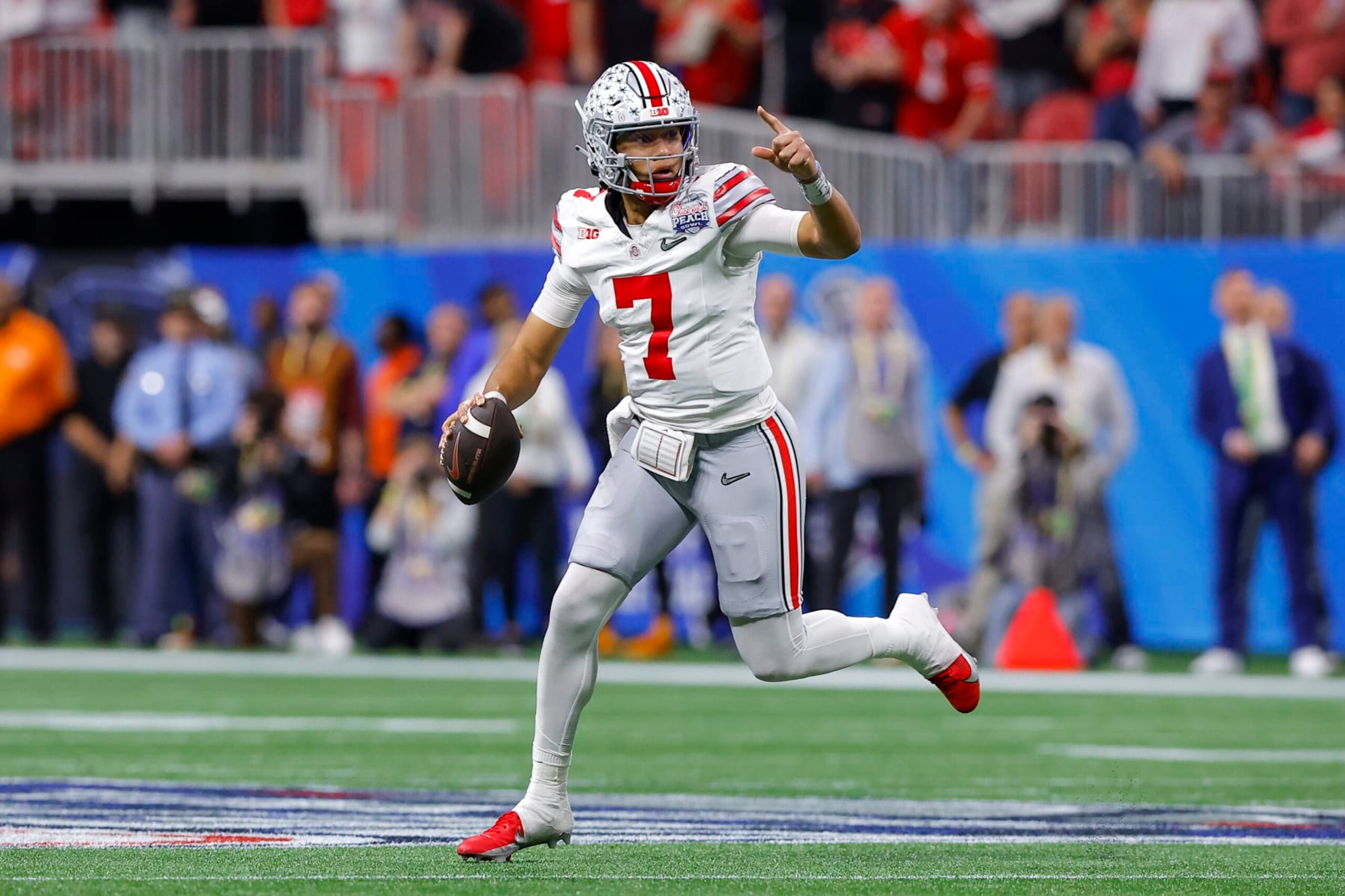 ATLANTA, GA - DECEMBER 31: C.J. Stroud #7 of the Ohio State Buckeyes rolls out in the first half against the Georgia Bulldogs in the Chick-fil-A Peach Bowl at Mercedes-Benz Stadium on December 31, 2022 in Atlanta, Georgia. (Photo by Todd Kirkland/Getty Images) ATLANTA, GA - DECEMBER 31: C.J. Stroud #7 of the Ohio State Buckeyes rolls out in the first half against the Georgia Bulldogs in the Chick-fil-A Peach Bowl at Mercedes-Benz Stadium on December 31, 2022 in Atlanta, Georgia. (Photo by Todd Kirkland/Getty Images)